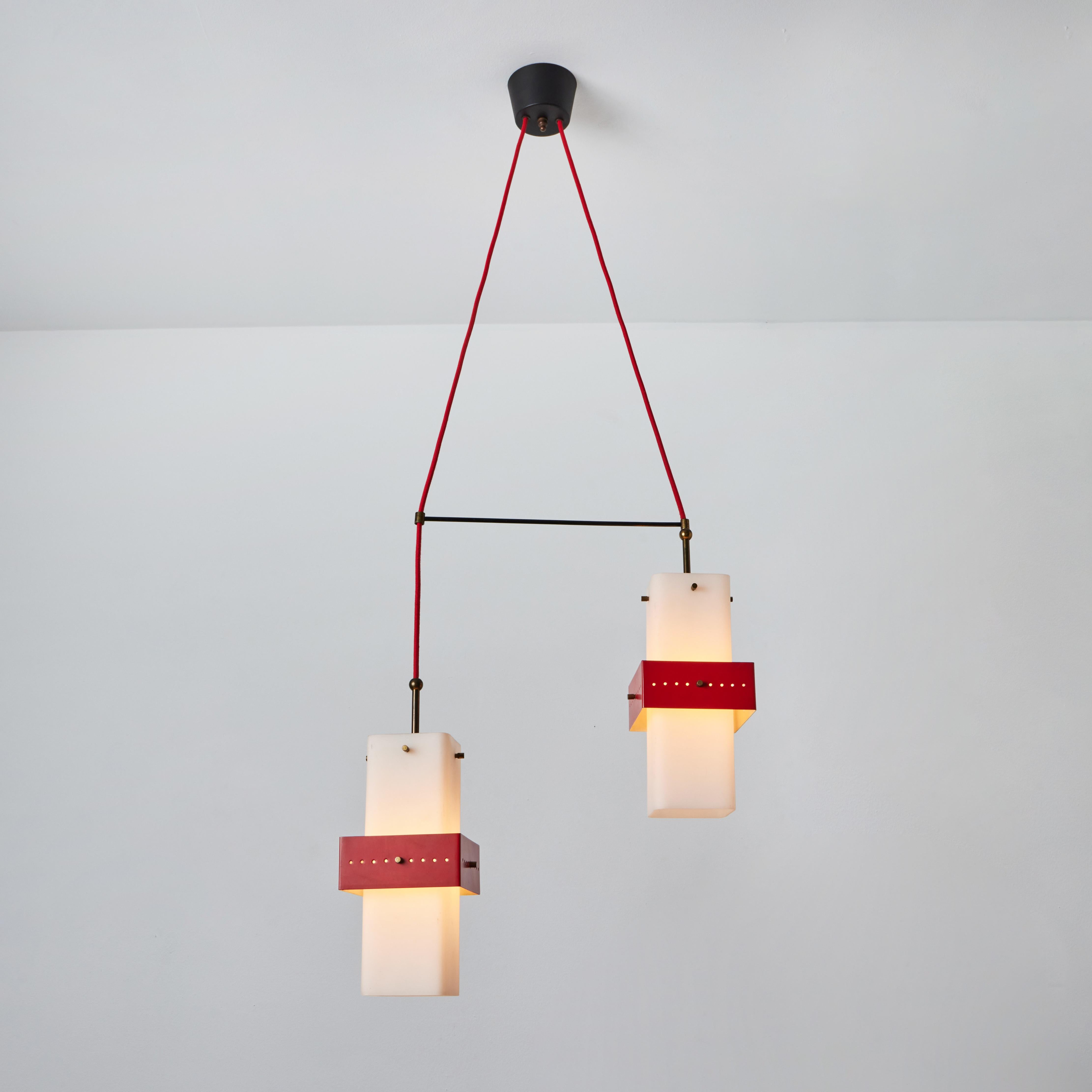 1950s Stilnovo red metal & opaline glass suspension lamp. A quintessentially 1950s Italian design executed in sculptural opaline glass, red painted metal, and brass hardware. A highly functional and refined suspension light of attractive scale and