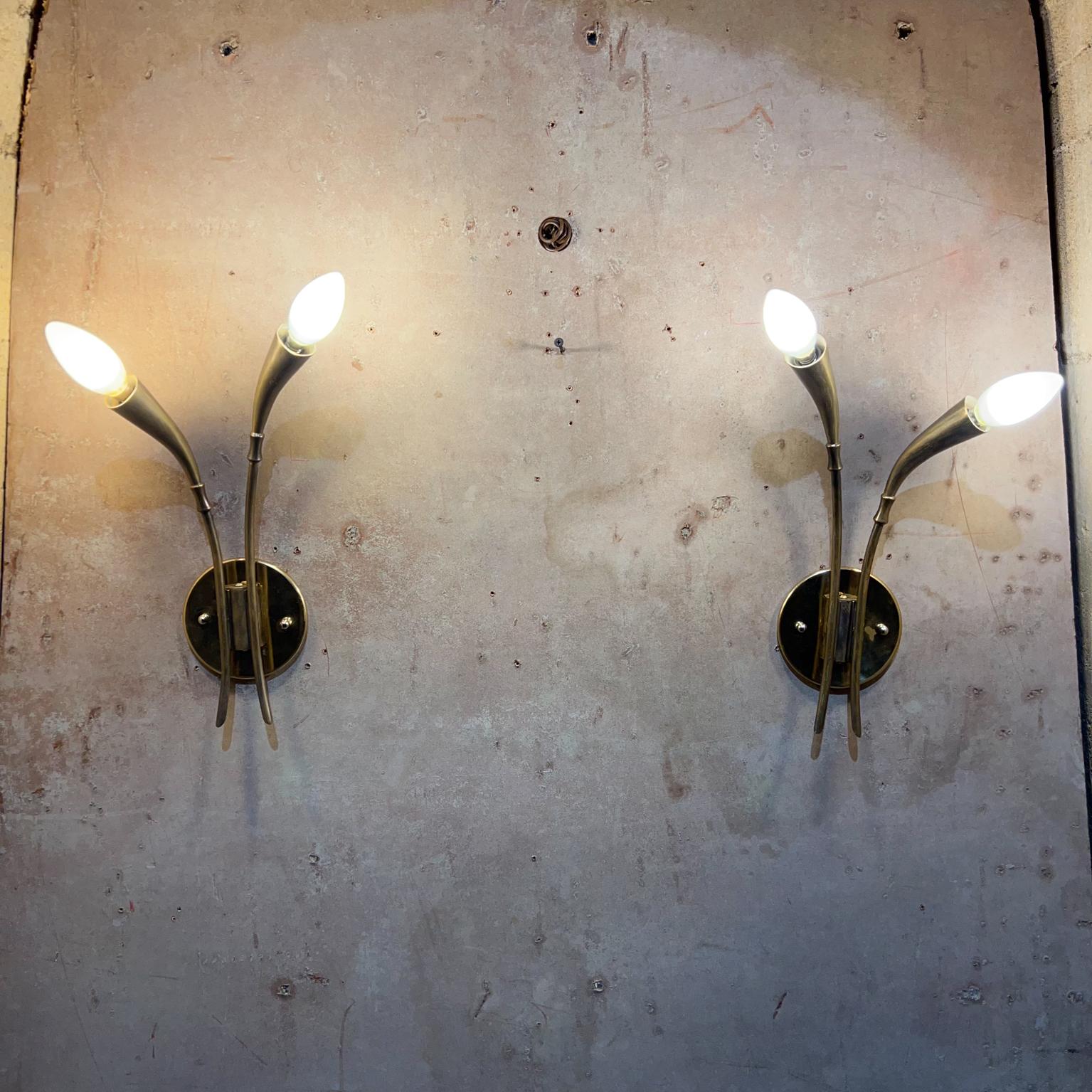 1950s Stilnovo sculptural Italian wall sconces in patinated brass Italy
Designed in a lovely flower bud shape
Two arms each sconce.
Vintage midcentury preowned condition.
Rewired and ready to go!
Sconces require four (4) E-14 Bulbs, not