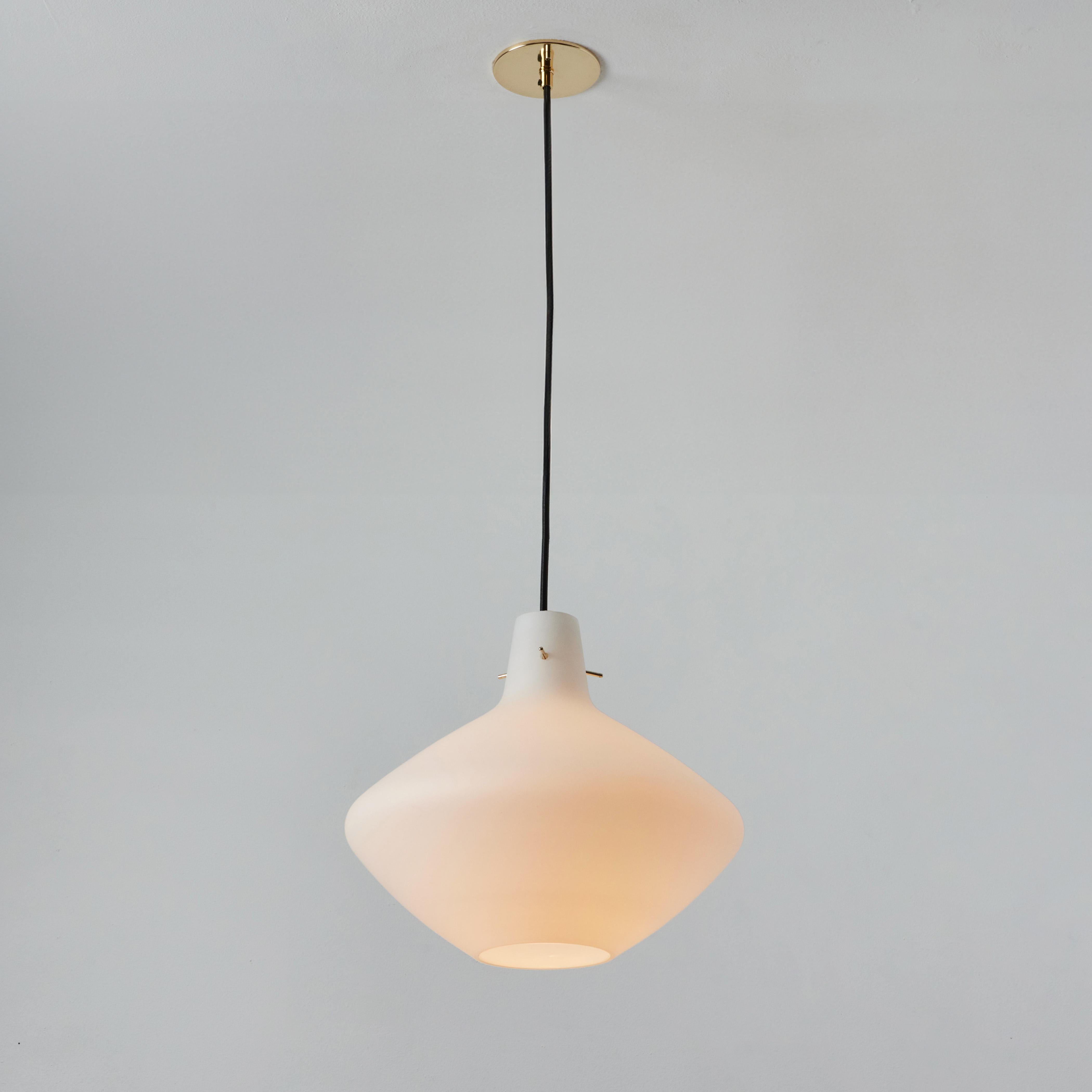 1950s Stilnovo Sculptural Opaline Glass Pendant. Executed in sculptural opaline glass with brass hardware pins. A highly refined ceiling lamp light of attractive scale and incomparable refinement. Unmarked.

Stilnovo was one of the most innovative