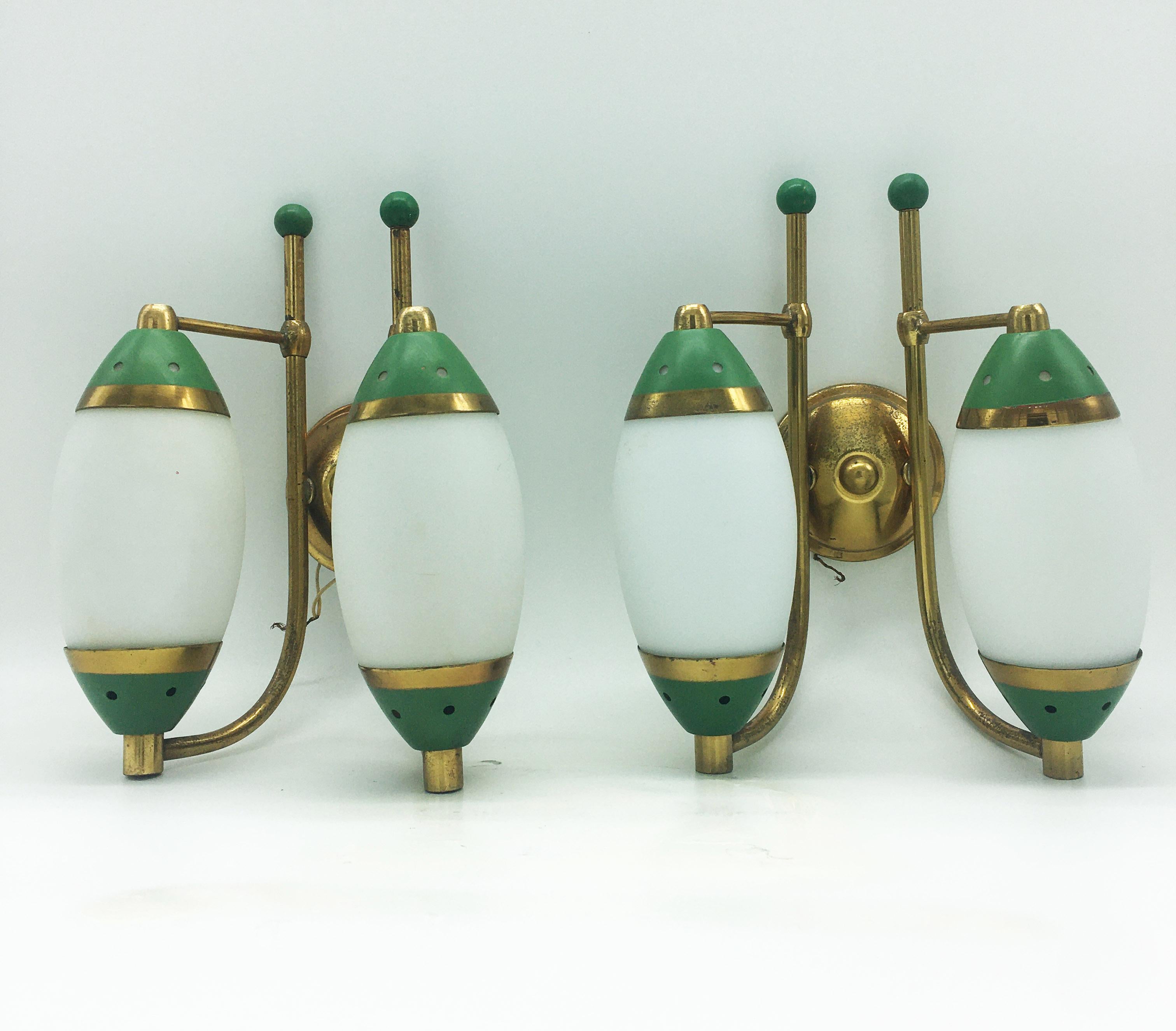 Italian design double-light wall lamp from the 1950s from the brand Stilnovo. Beautifully made with opaline glass and brass and finished with green details.