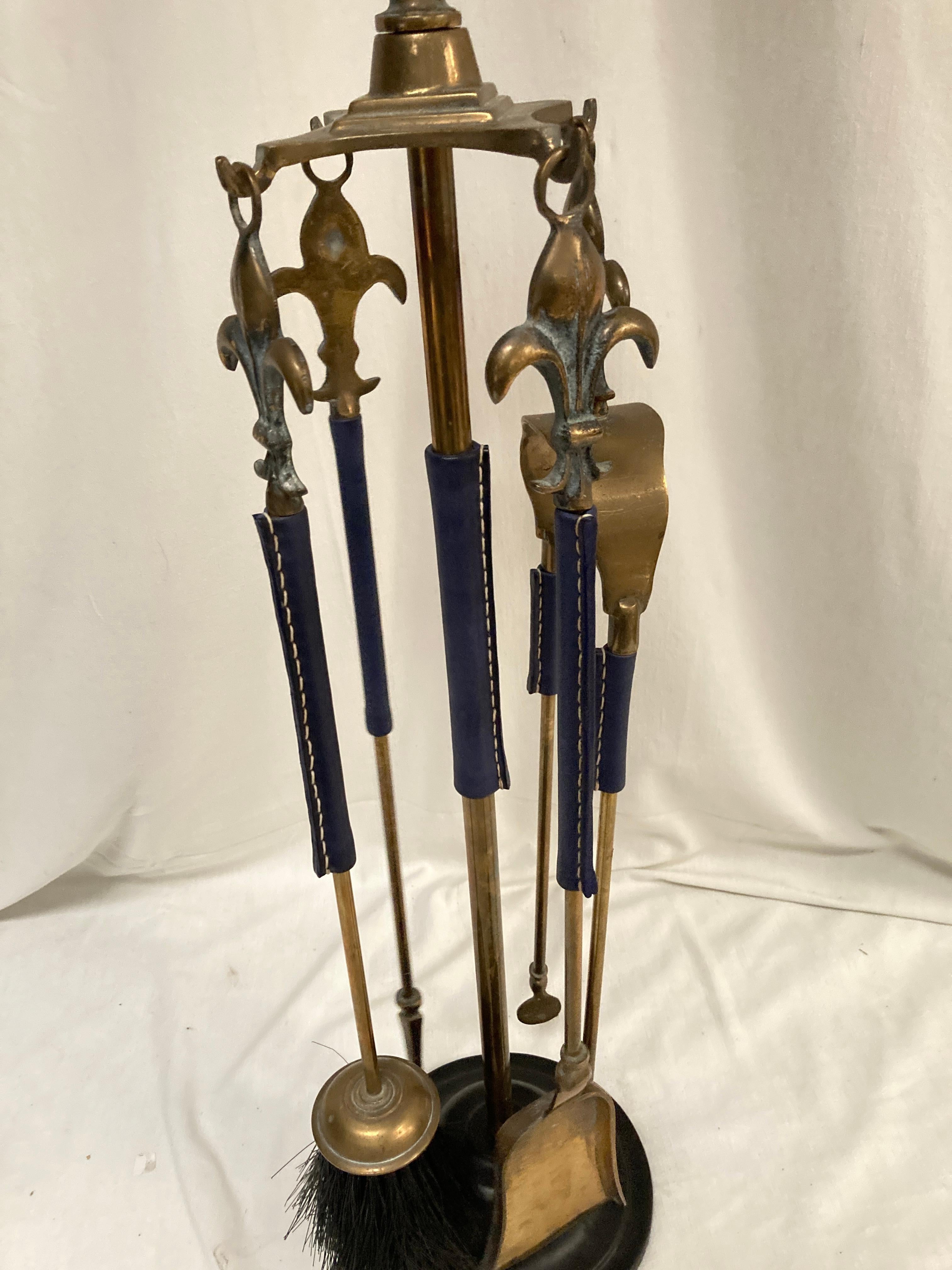 1950's Stitched leather and bronze mantles 
Dark blue leather
France