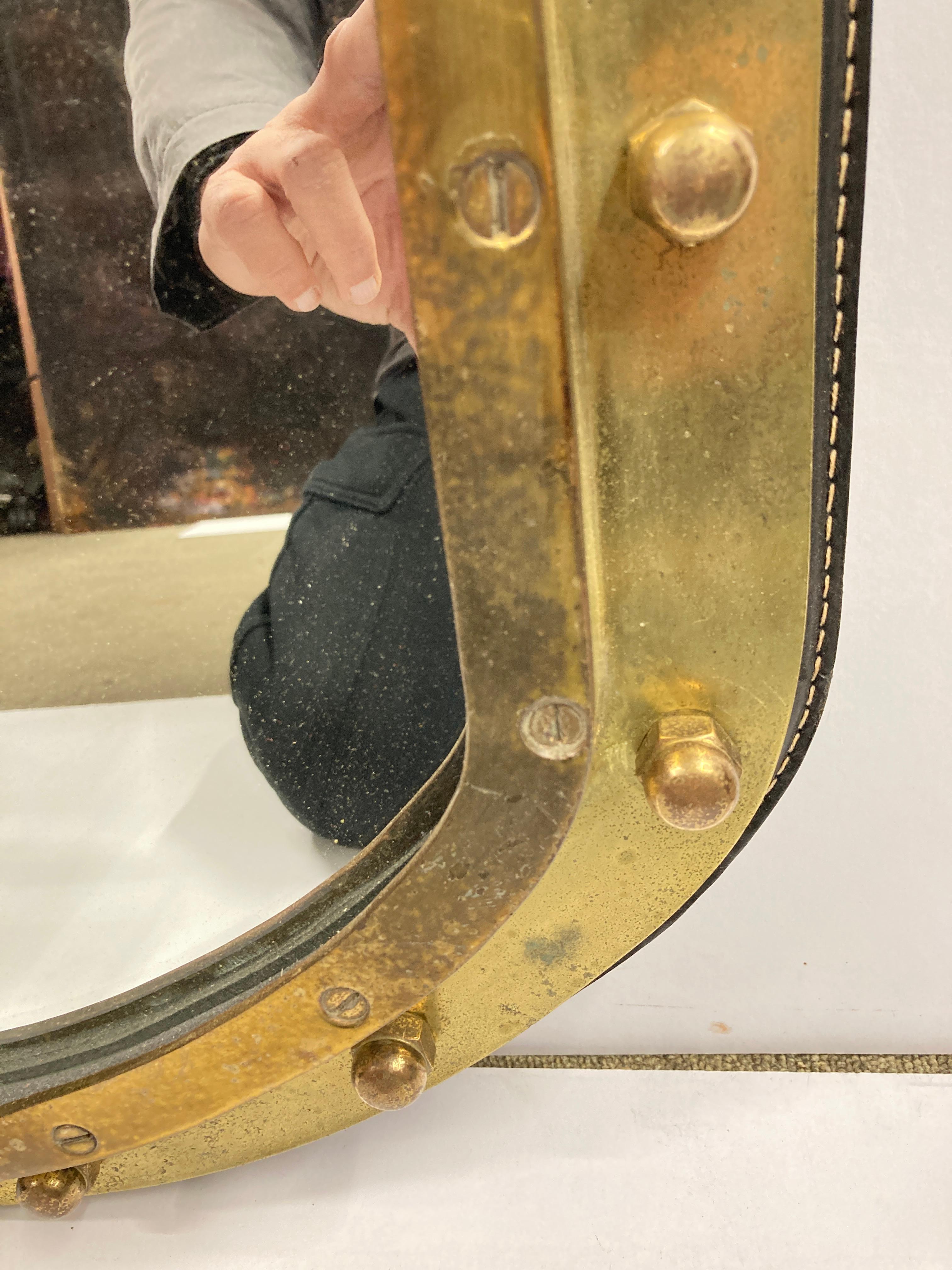 1950's Stitched leather and bronze wall Mirror by Jacques Adnet For Sale 1