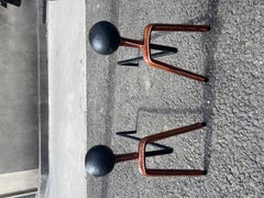 1950's Stitched leather and cast iron andiron by Jacques Adnet