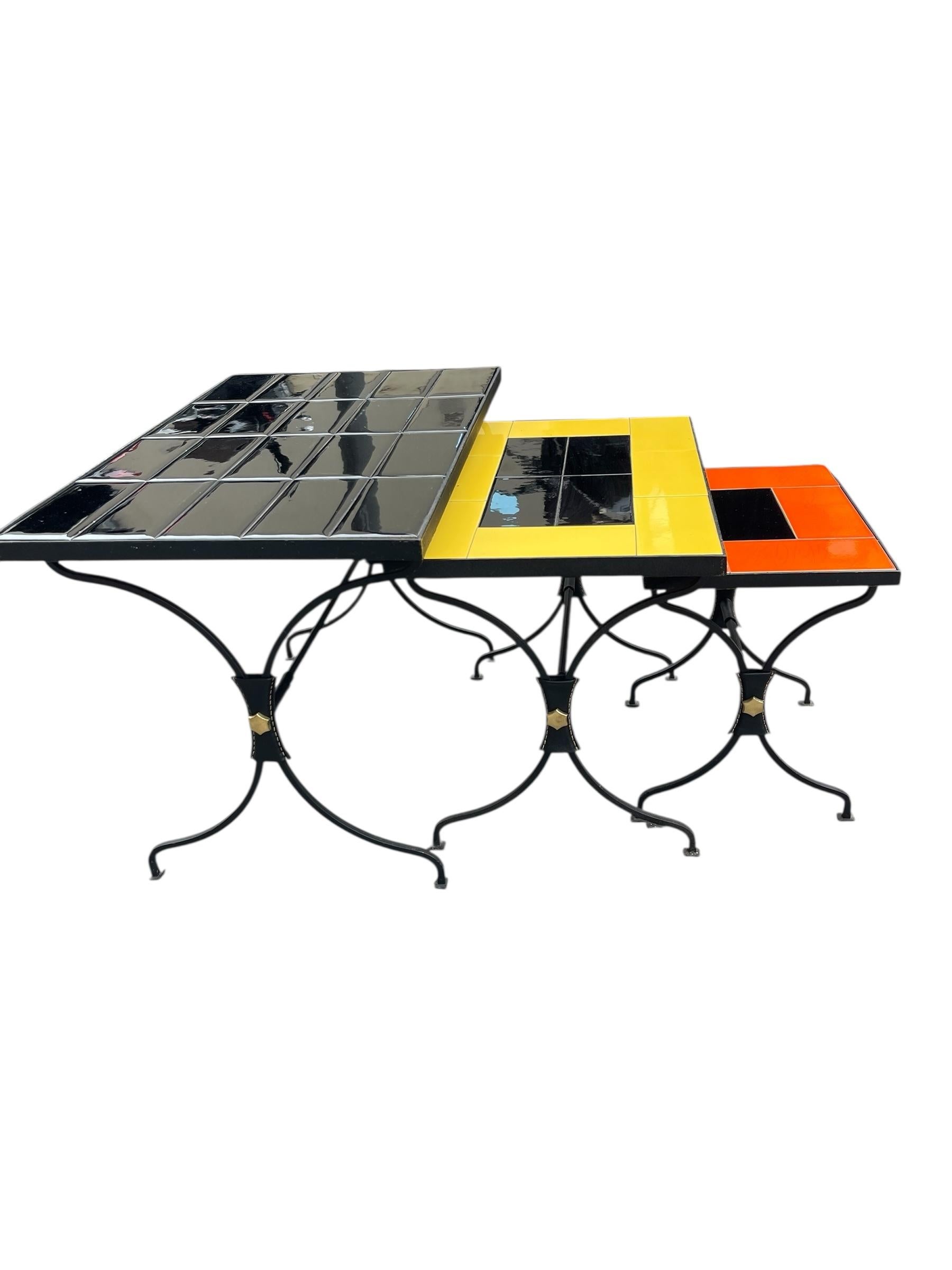 Metal 1950's Stitched leather and ceramic nesting tables by Jacques Adnet For Sale