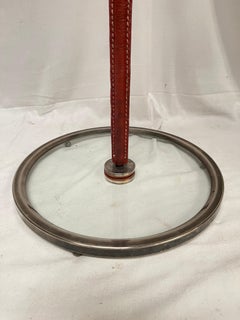 1950's Stitched leather and glass center table by Jacques Adnet