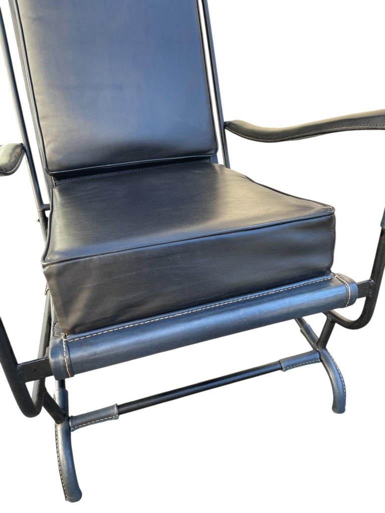 1950's Stitched leather and metal armchair by Jacques Adnet For