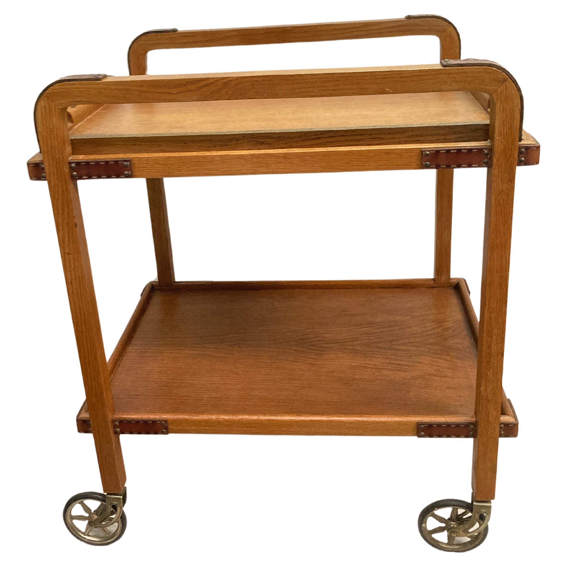 1950's Stitched leather and oak bar cart by Jacques Adnet