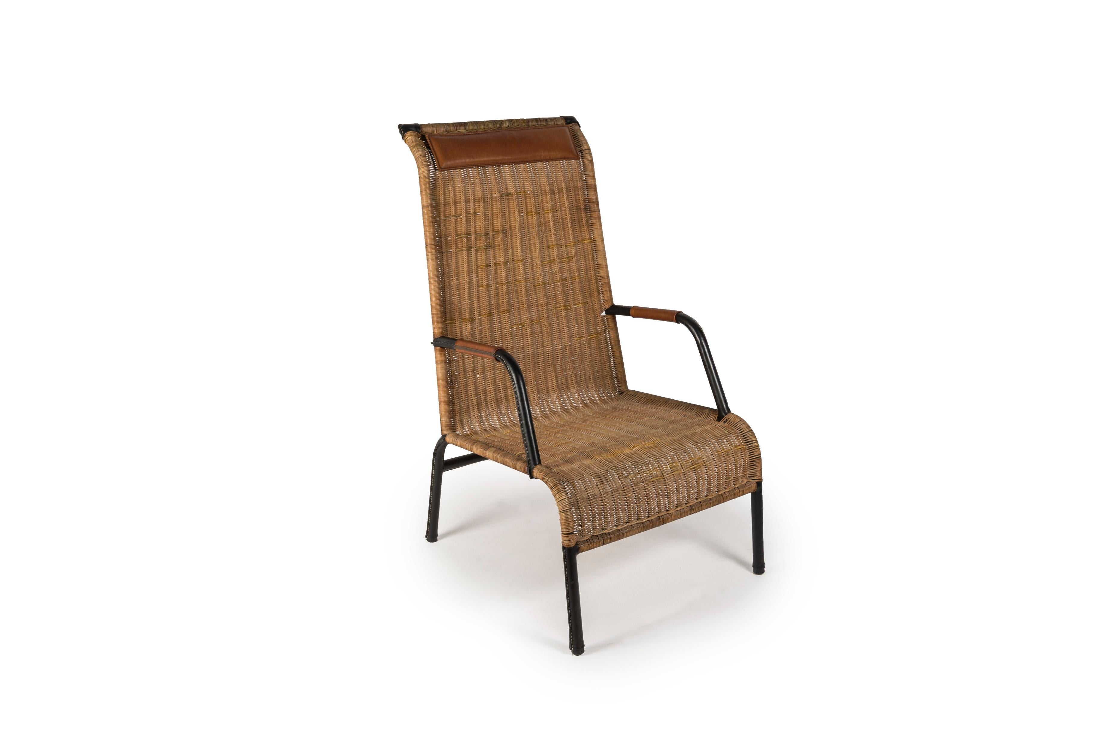 1950's Stitched leather and rattan armchairs by Jacques Adnet
France 
Rattan have been repair 