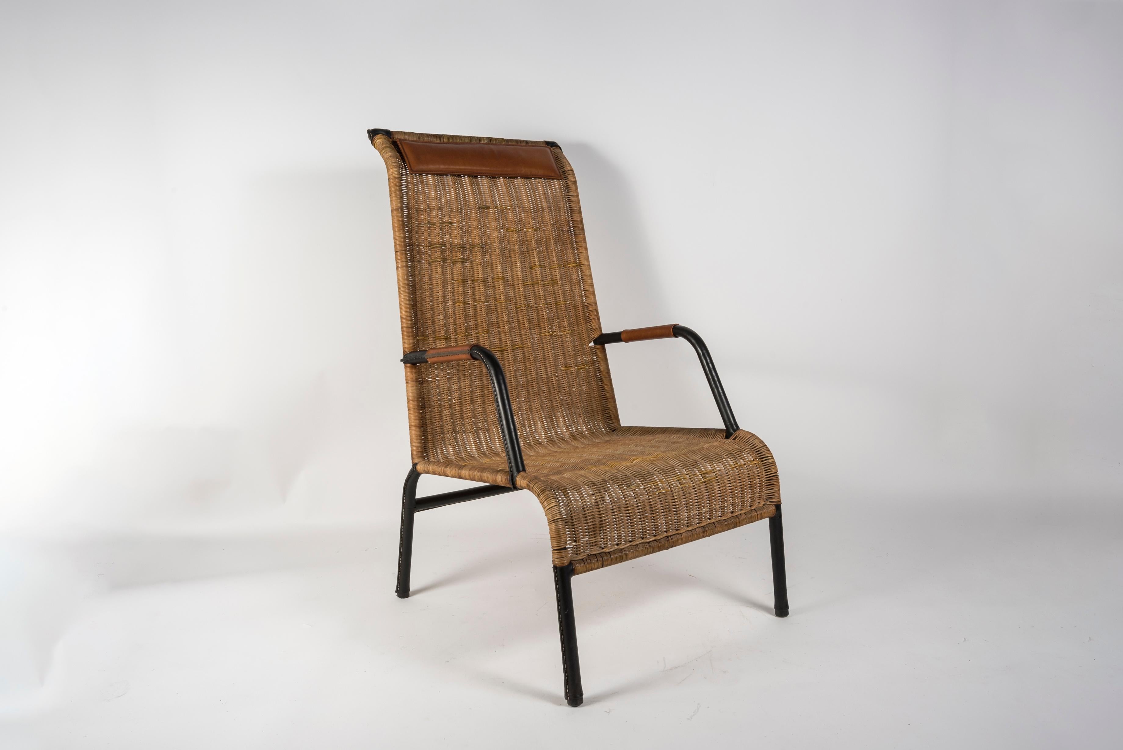 French 1950's Stitched leather and rattan armchairs by Jacques Adnet For Sale
