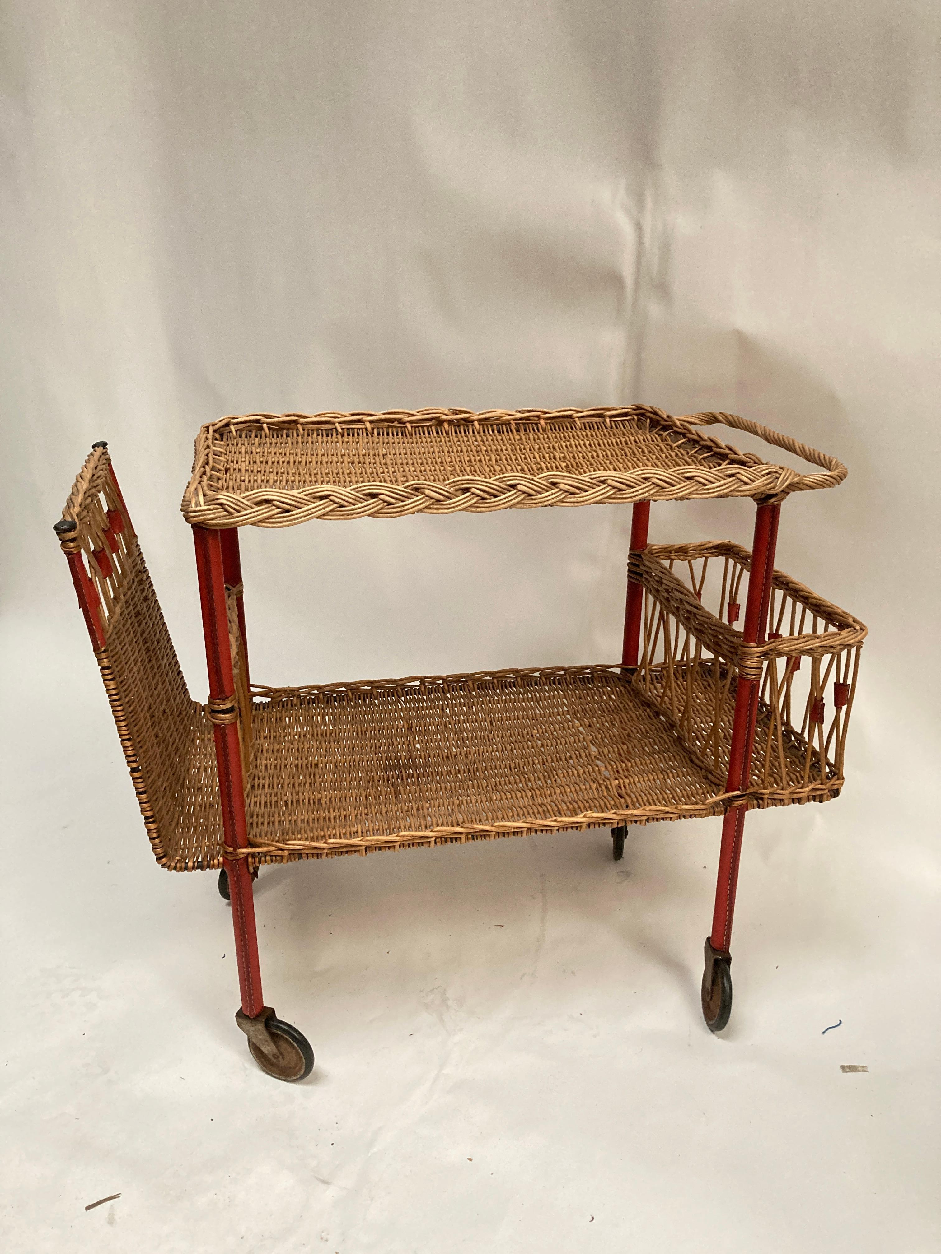 1950's Stitched leather and rattan bar cart by Jacques Adnet
Rare in red
Good condition

