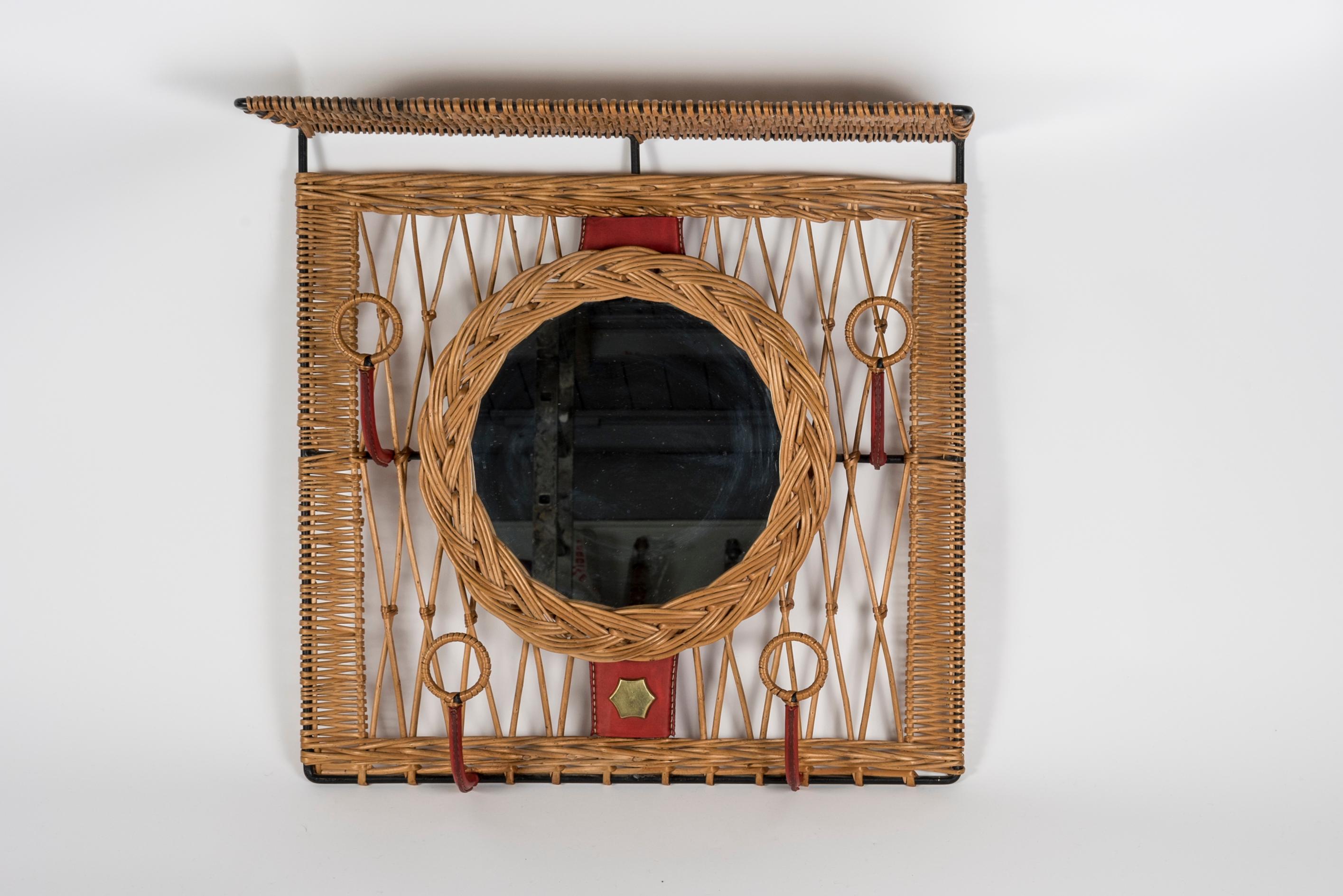 European 1950's Stitched leather and rattan wall mirror by Jacques Adnet For Sale