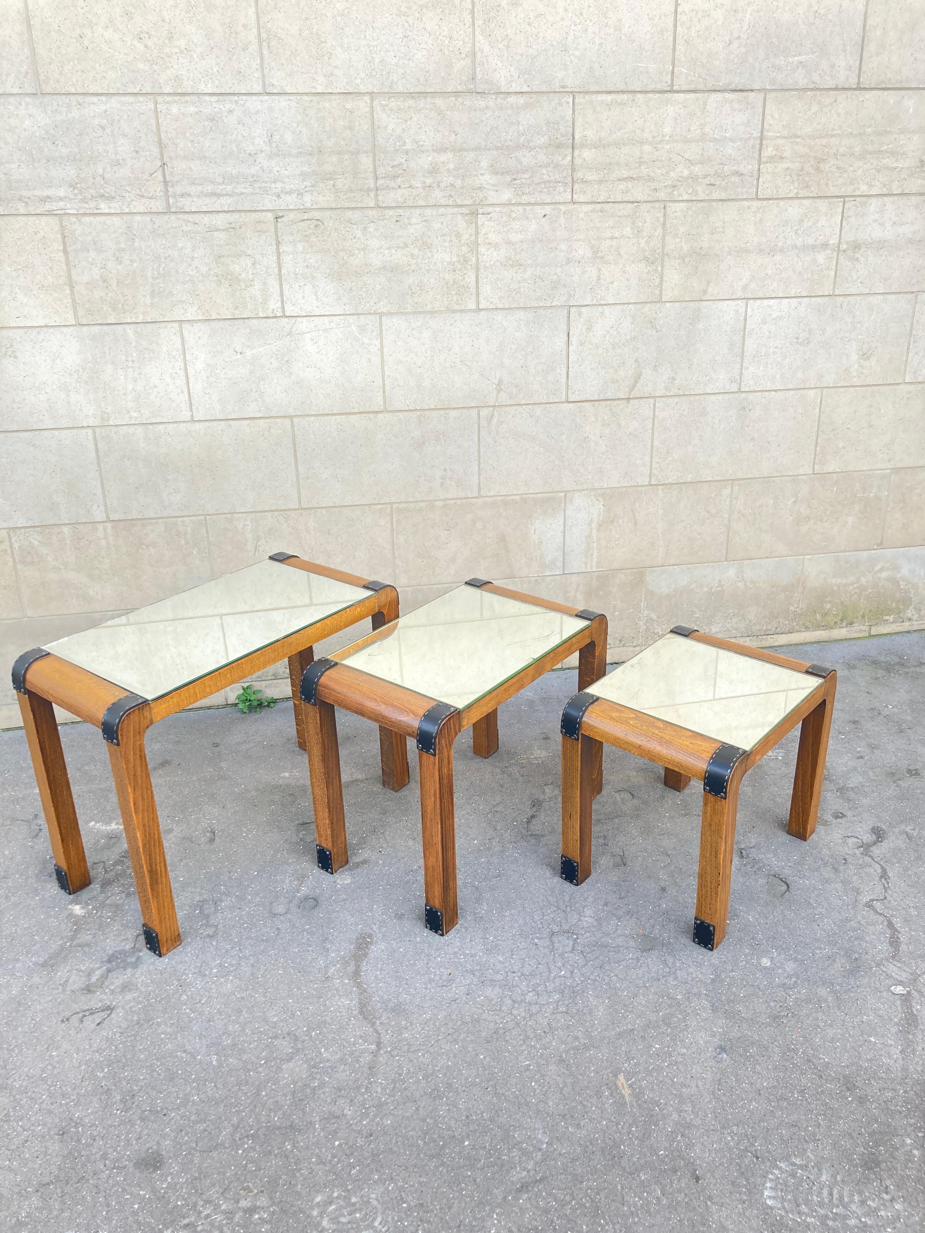 Leather 1950's Stitched leather and wood set of  nesting tables by Jacques Adnet For Sale
