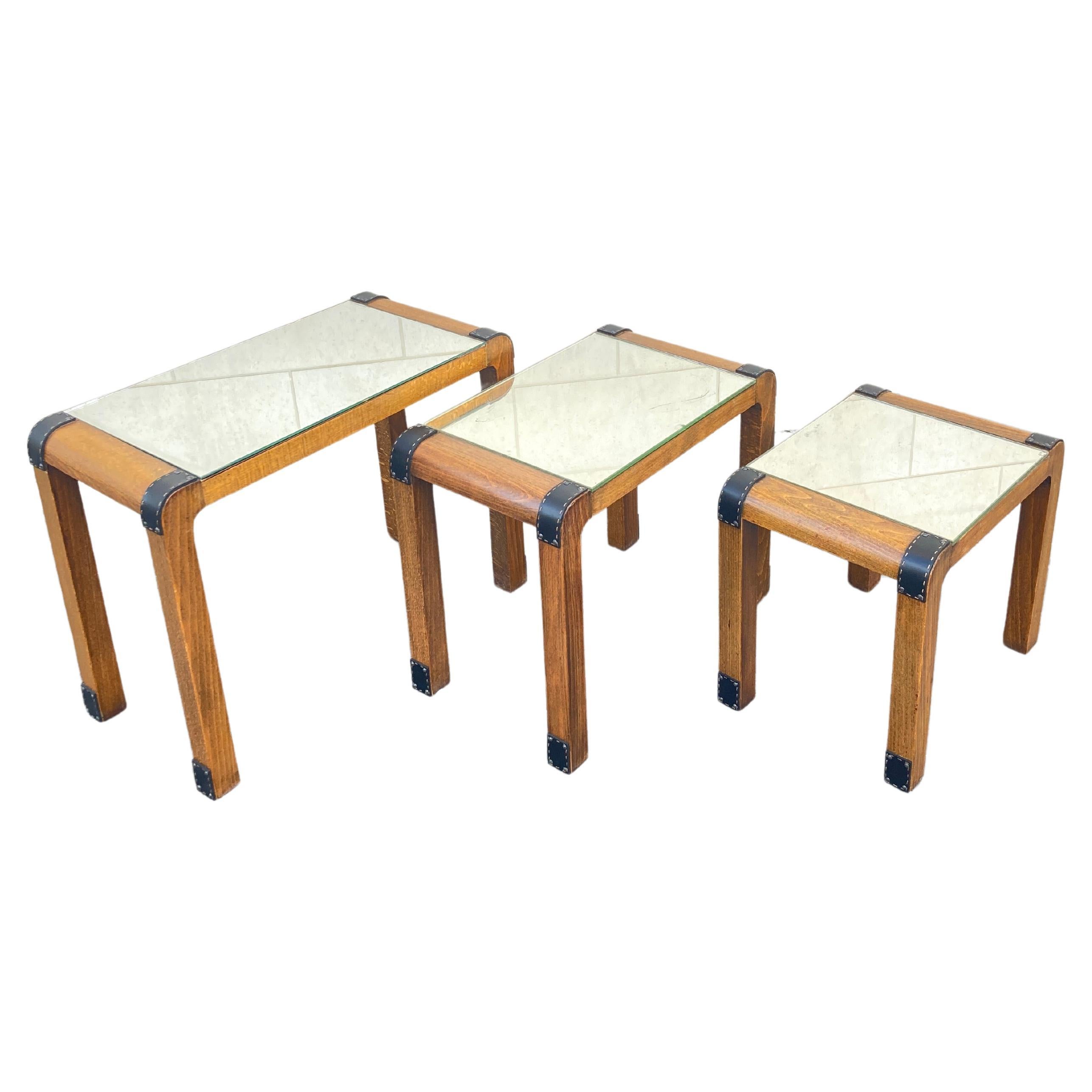 1950's Stitched leather and wood set of  nesting tables by Jacques Adnet For Sale