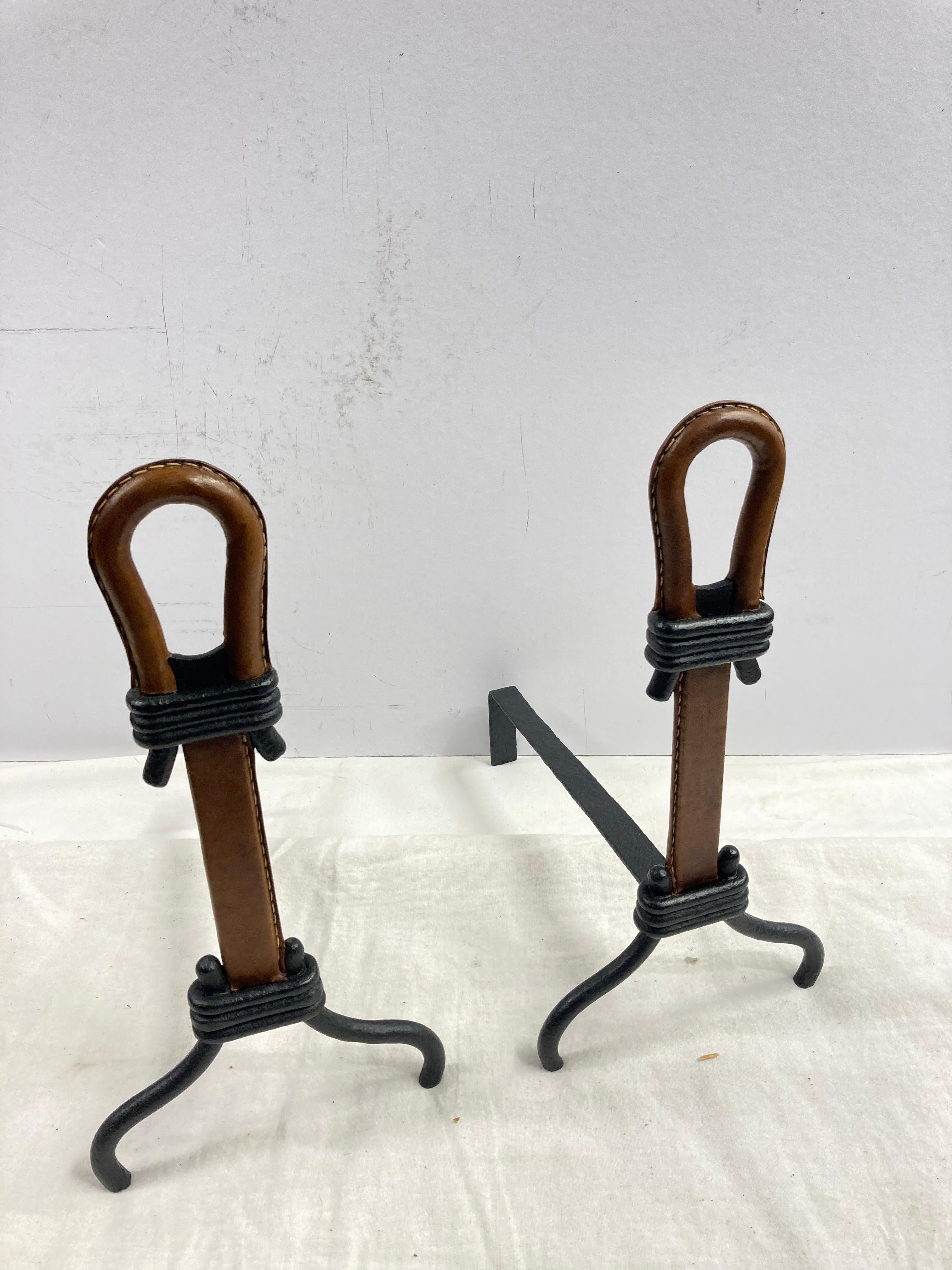 1950's Stitched leather andirons by Jacques Adnet
