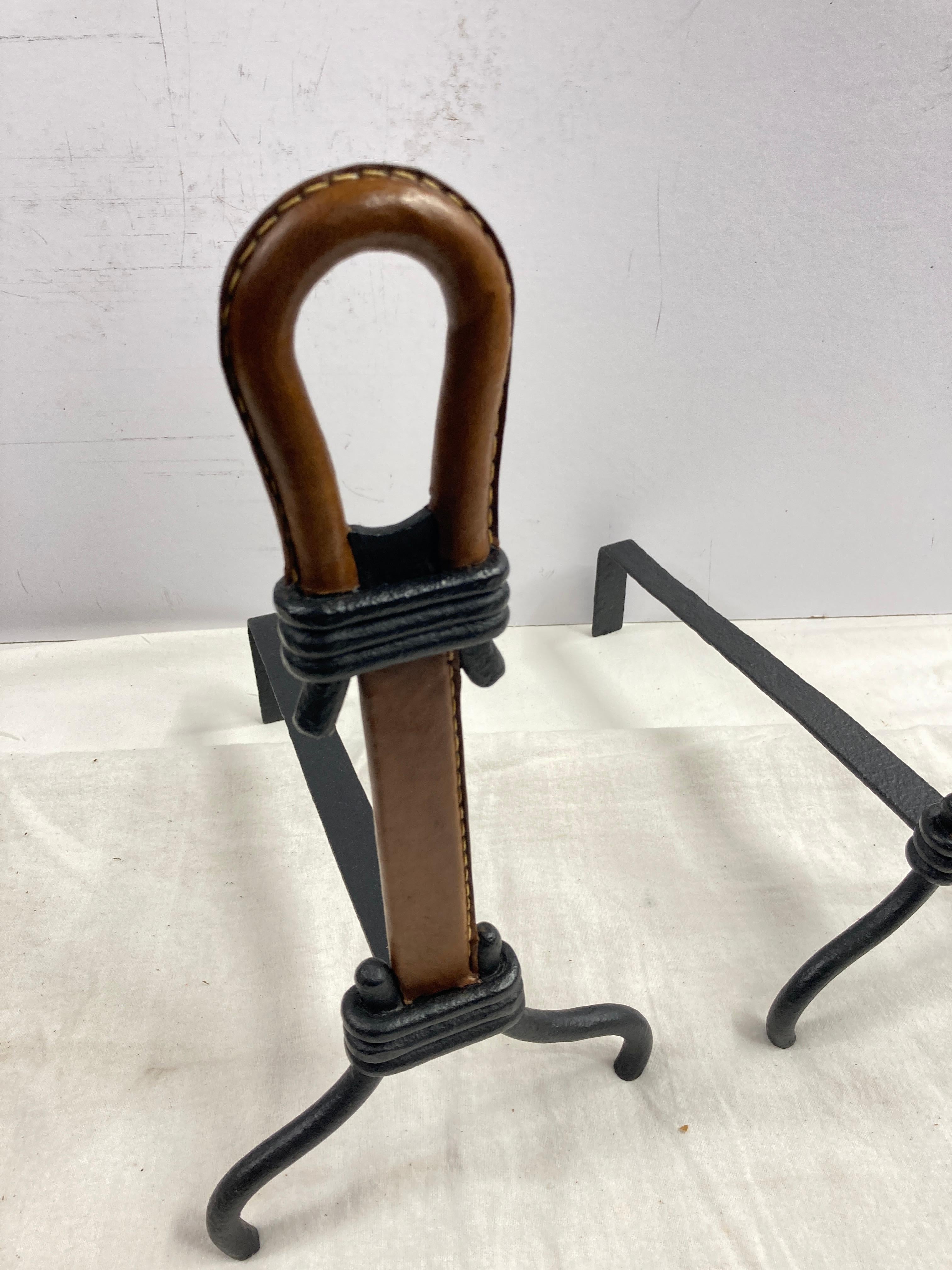 European 1950's Stitched leather andirons by Jacques Adnet For Sale