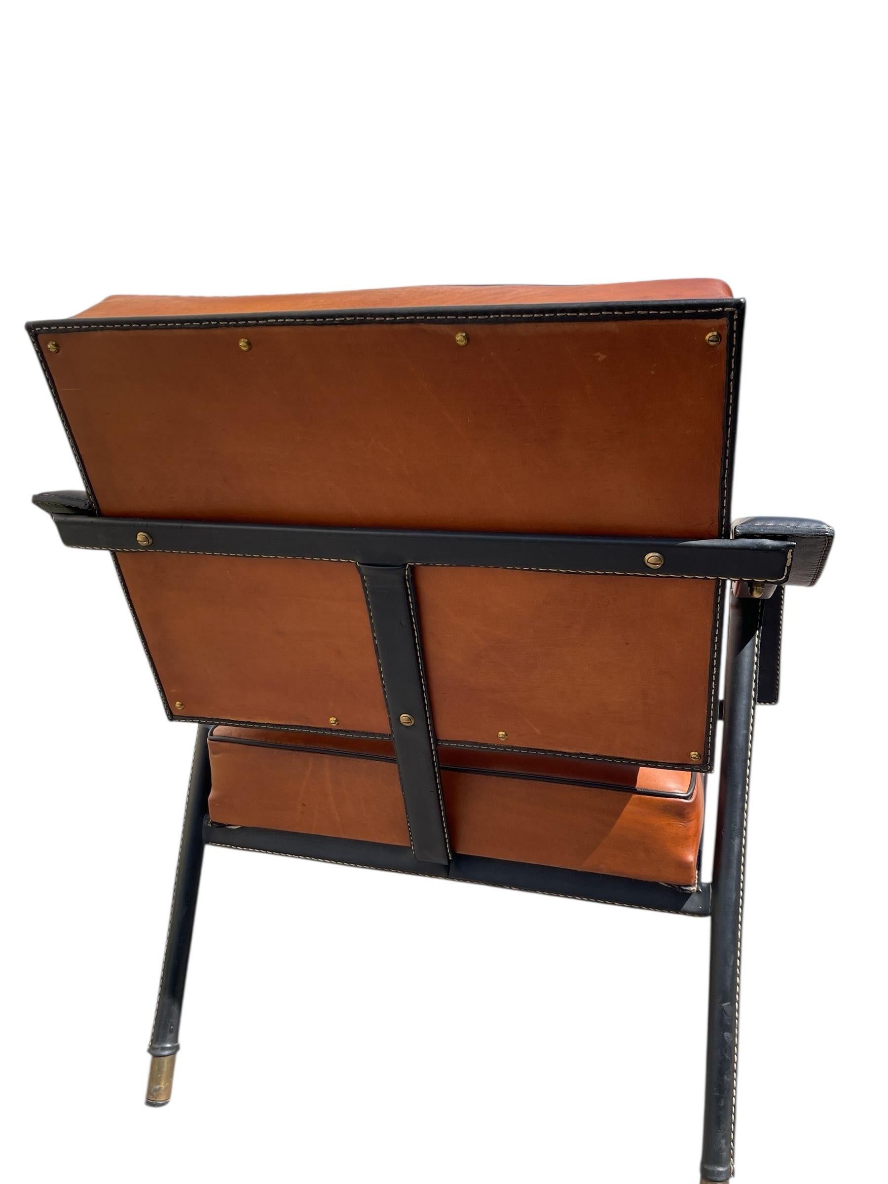 1950's Stitched leather armchair designed by Jacques Adnet
Documented


