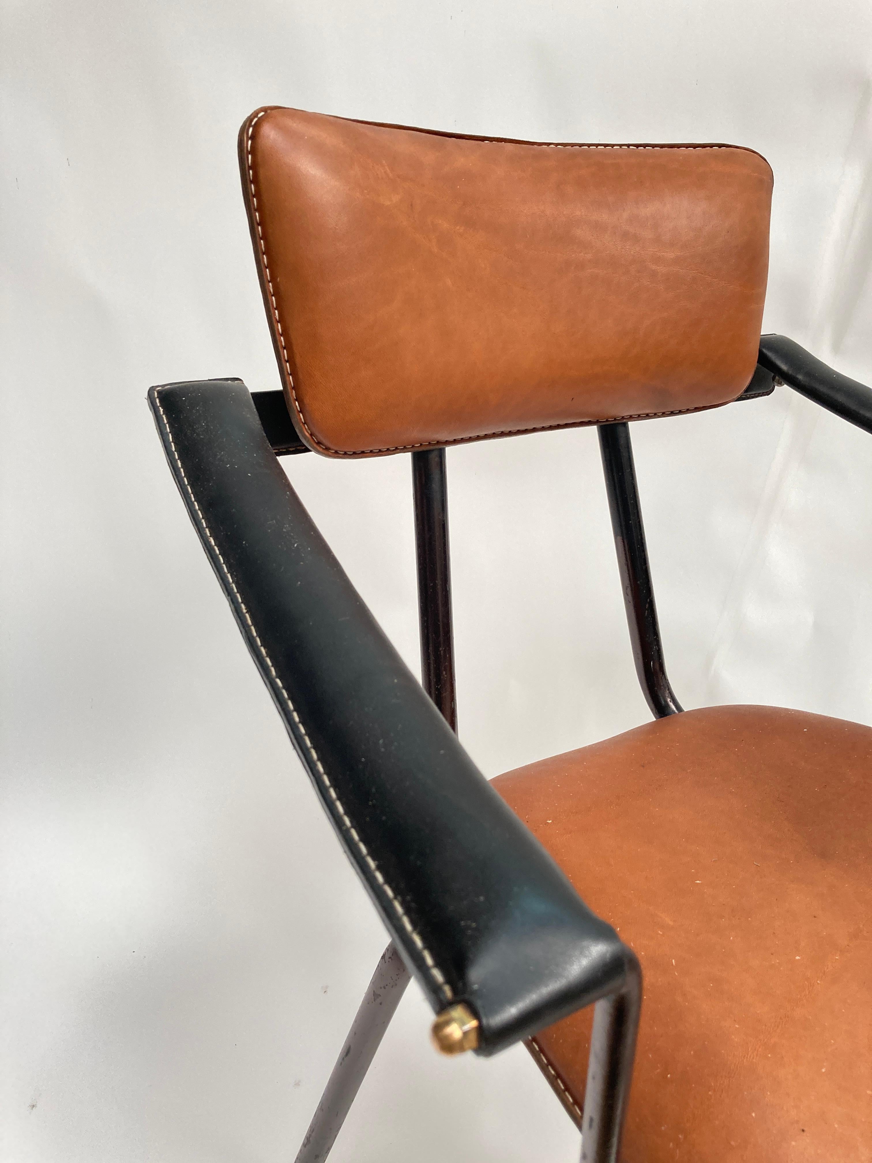 European 1950's Stitched leather armchair by Jacques Adnet  For Sale