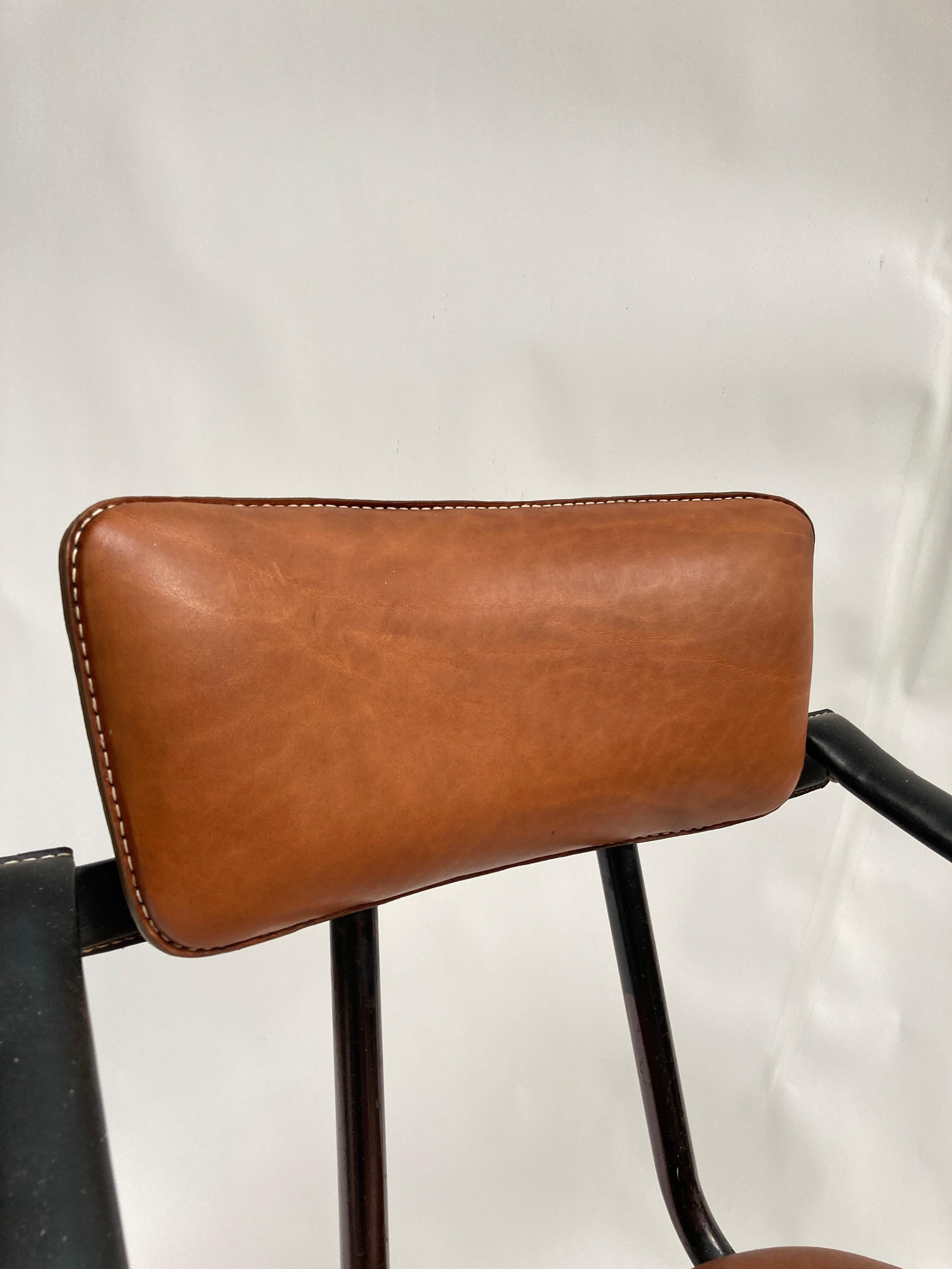 Mid-20th Century 1950's Stitched leather armchair by Jacques Adnet  For Sale