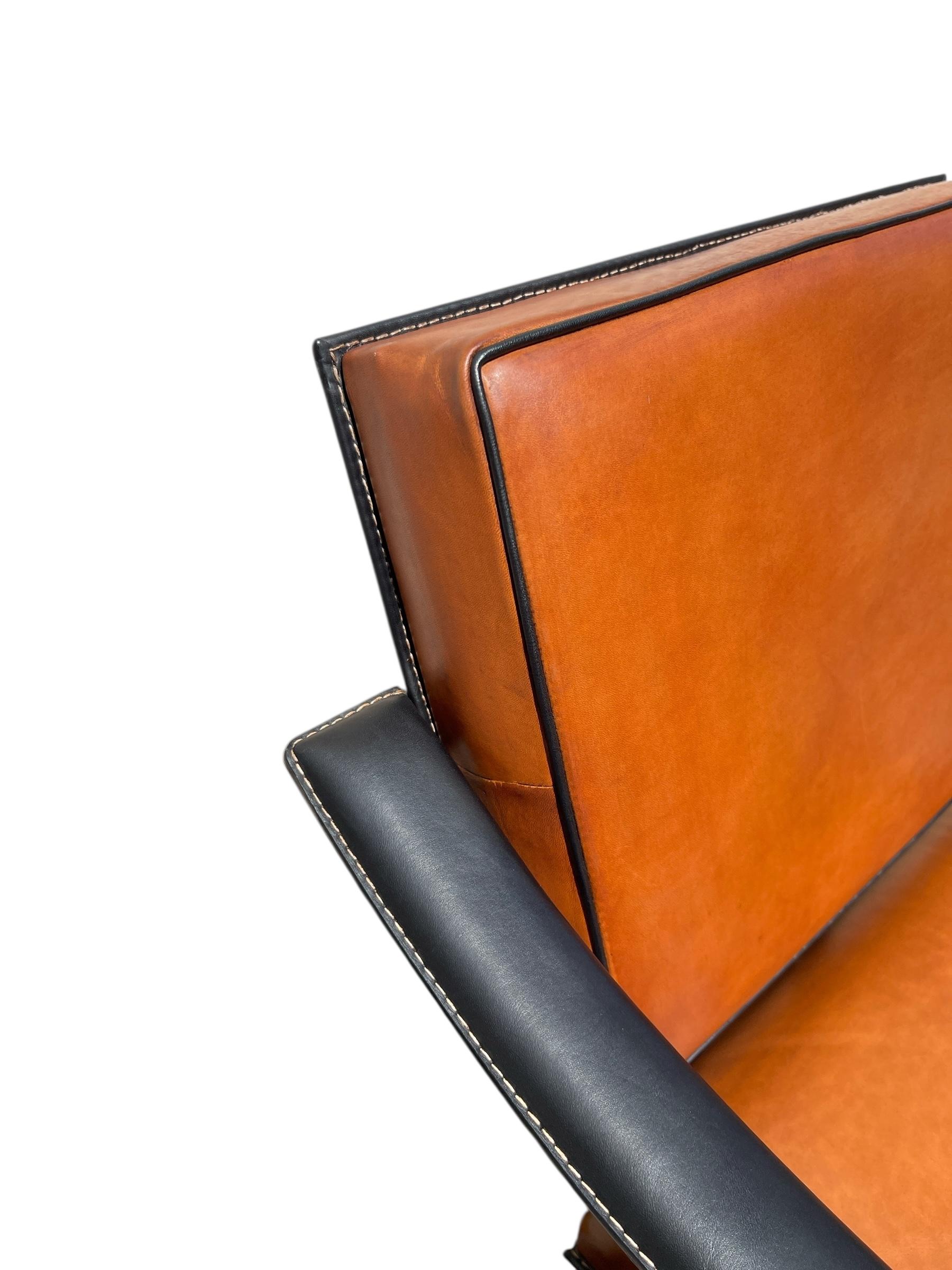 Mid-20th Century 1950's Stitched leather armchair by Jacques Adnet For Sale