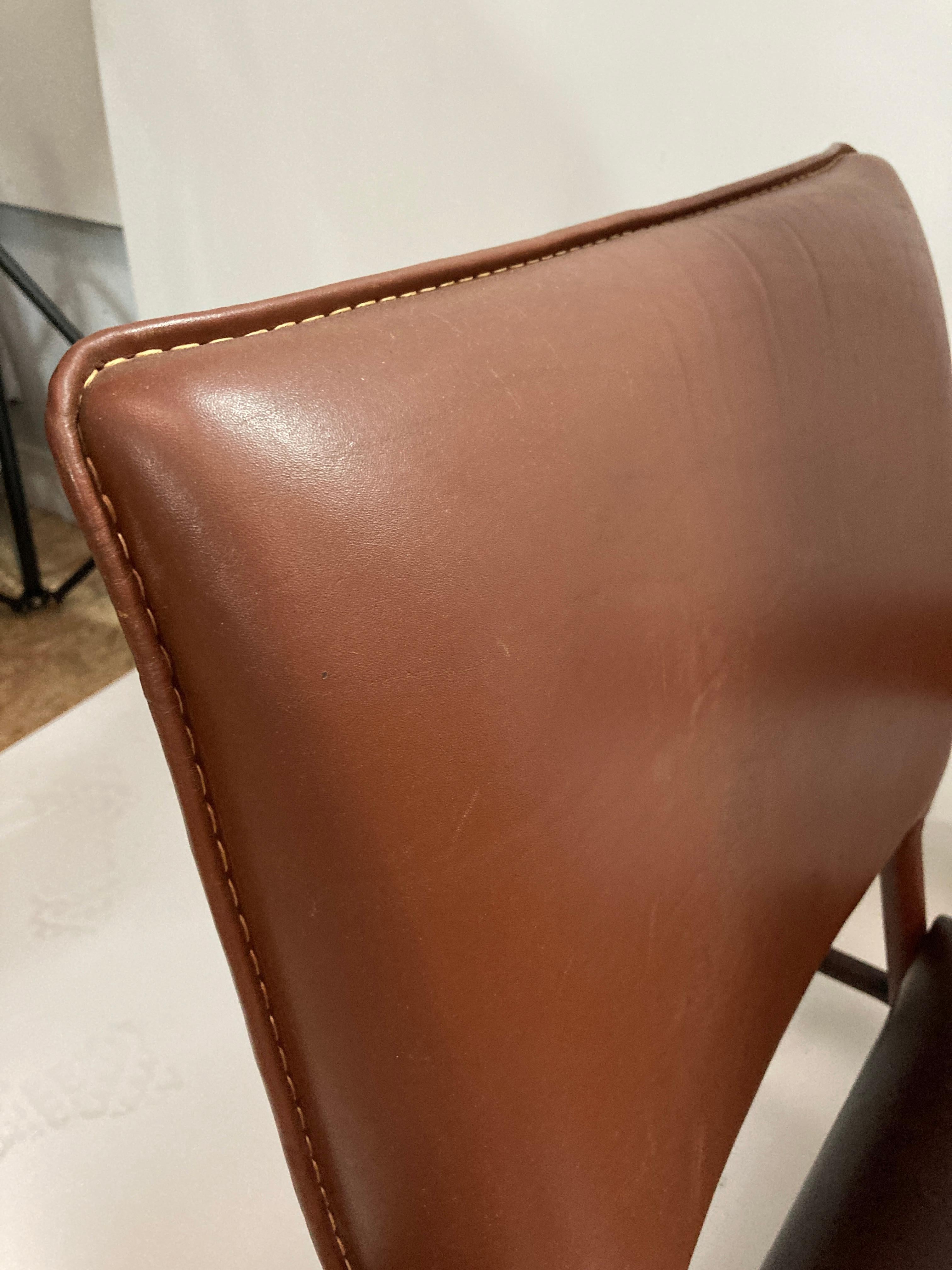 Leather 1950's Stitched leather armchair by Jacques Adnet  For Sale