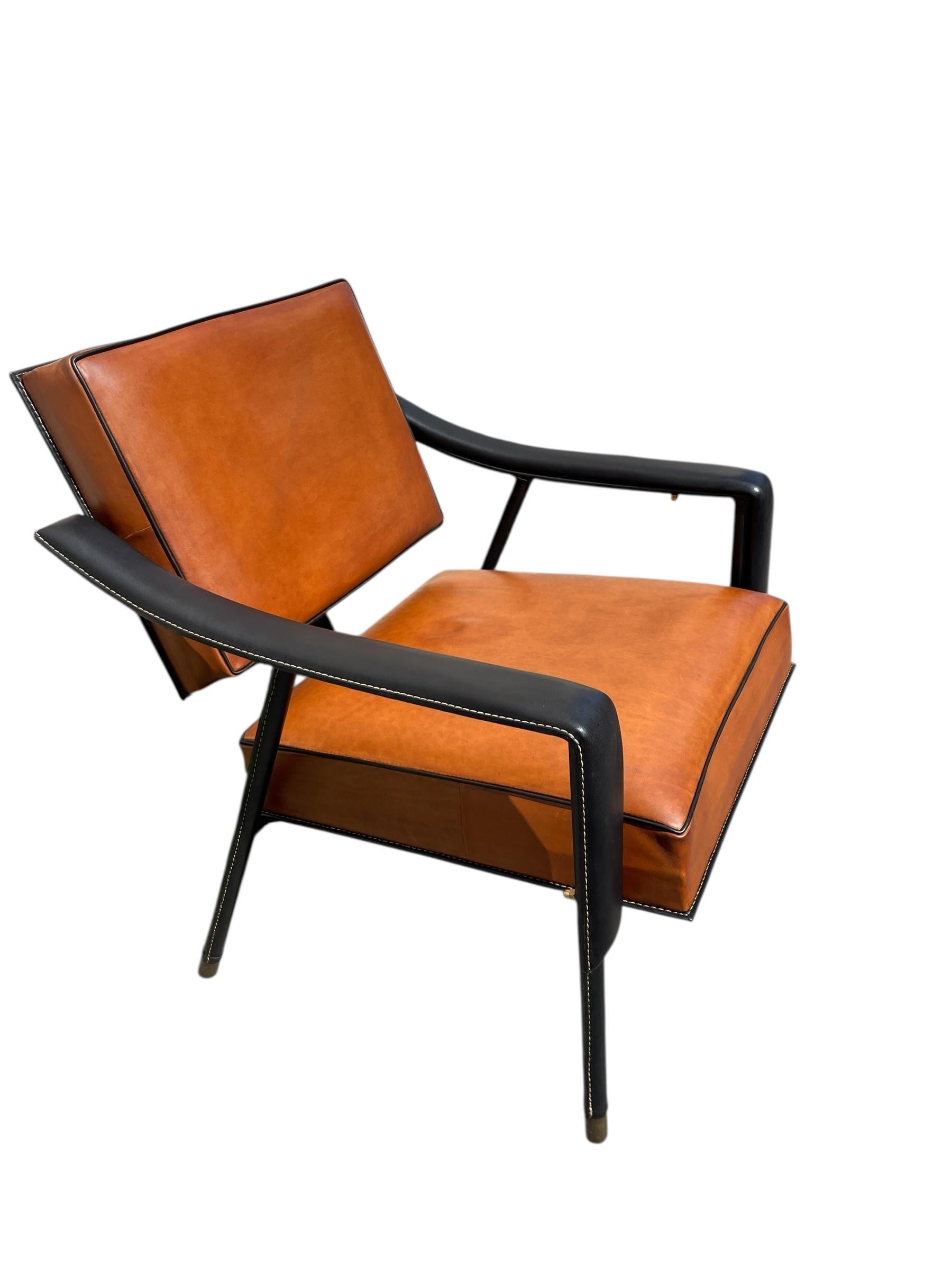 Leather 1950's Stitched leather armchair by Jacques Adnet For Sale
