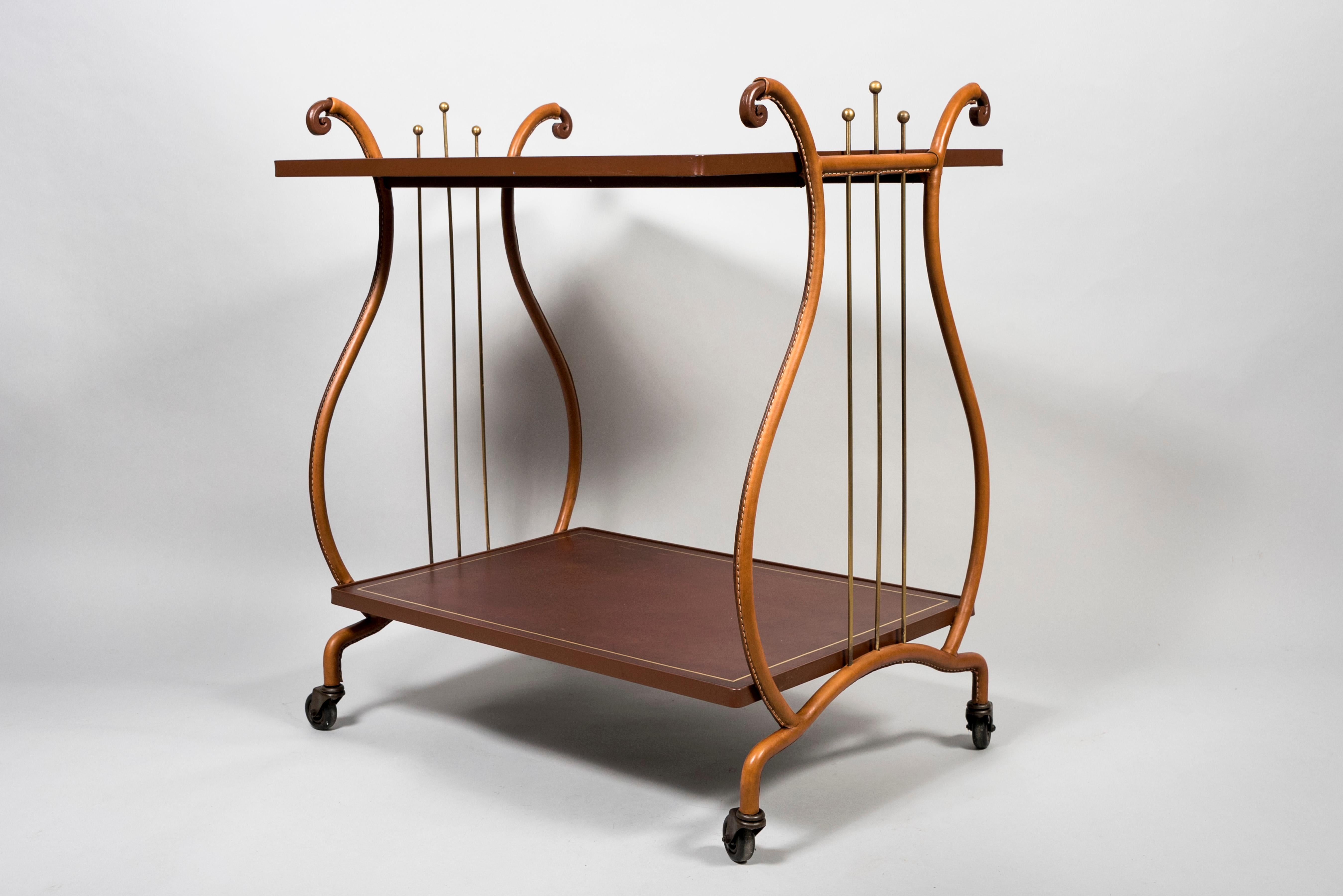1950's Stitched leather bar cart by Jacques Adnet
Very rare neo-classique Lyre modèle.
    
