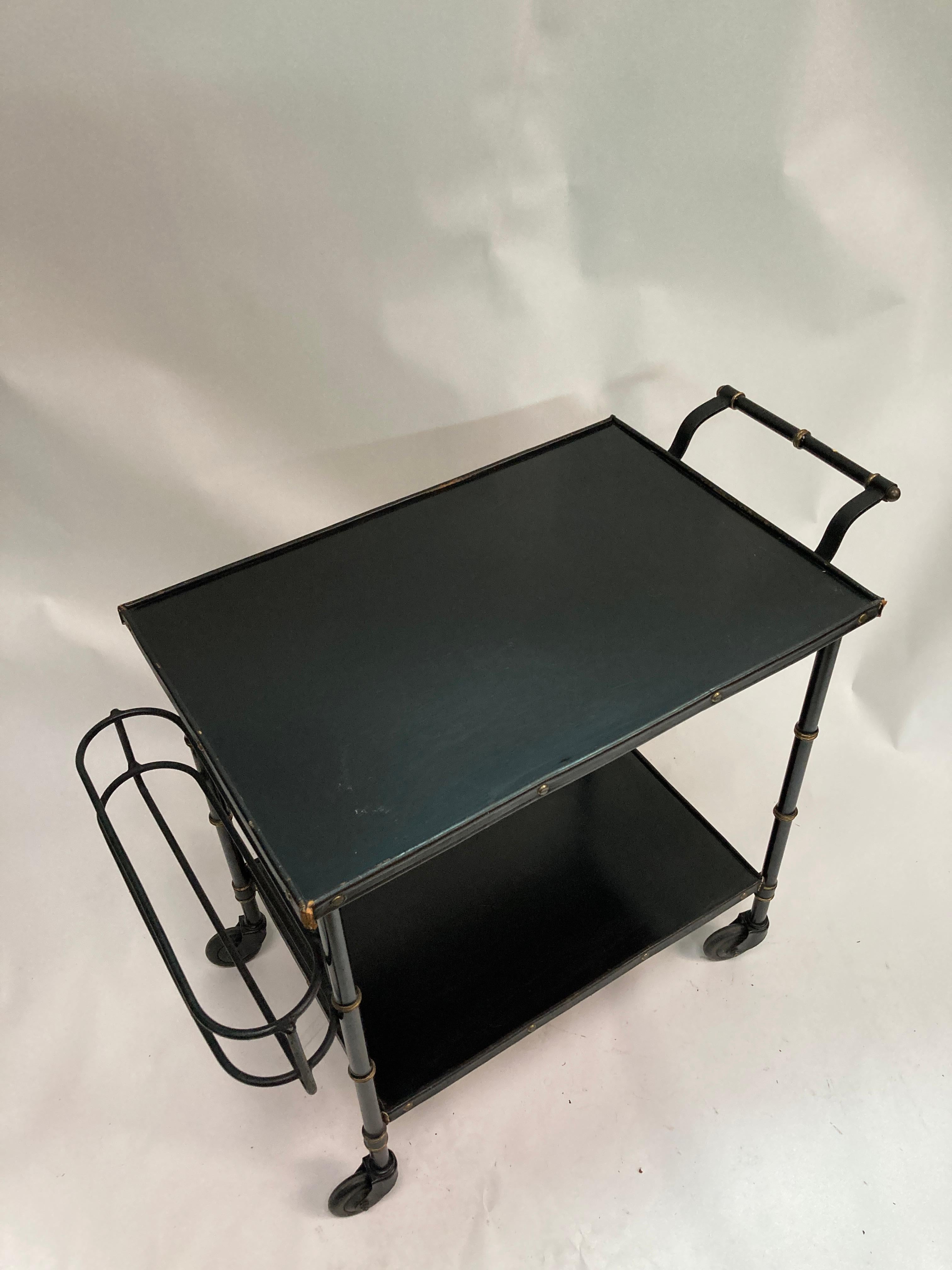 1950's Stitched leather bar cart by Jacques Adnet
with is removable bottle rack
Great condition

