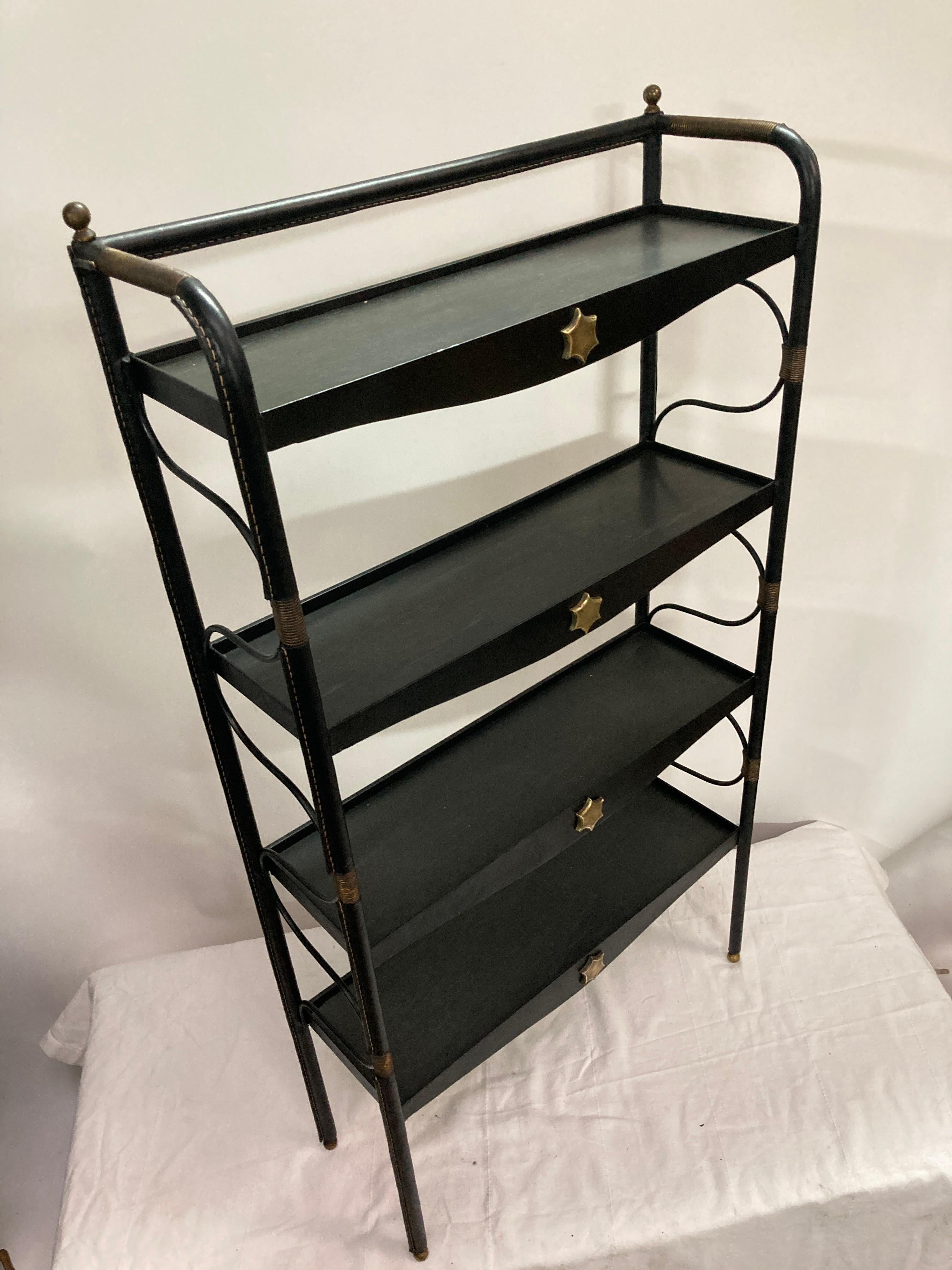 Metal 1950's Stitched leather book case by Jacques Adnet For Sale