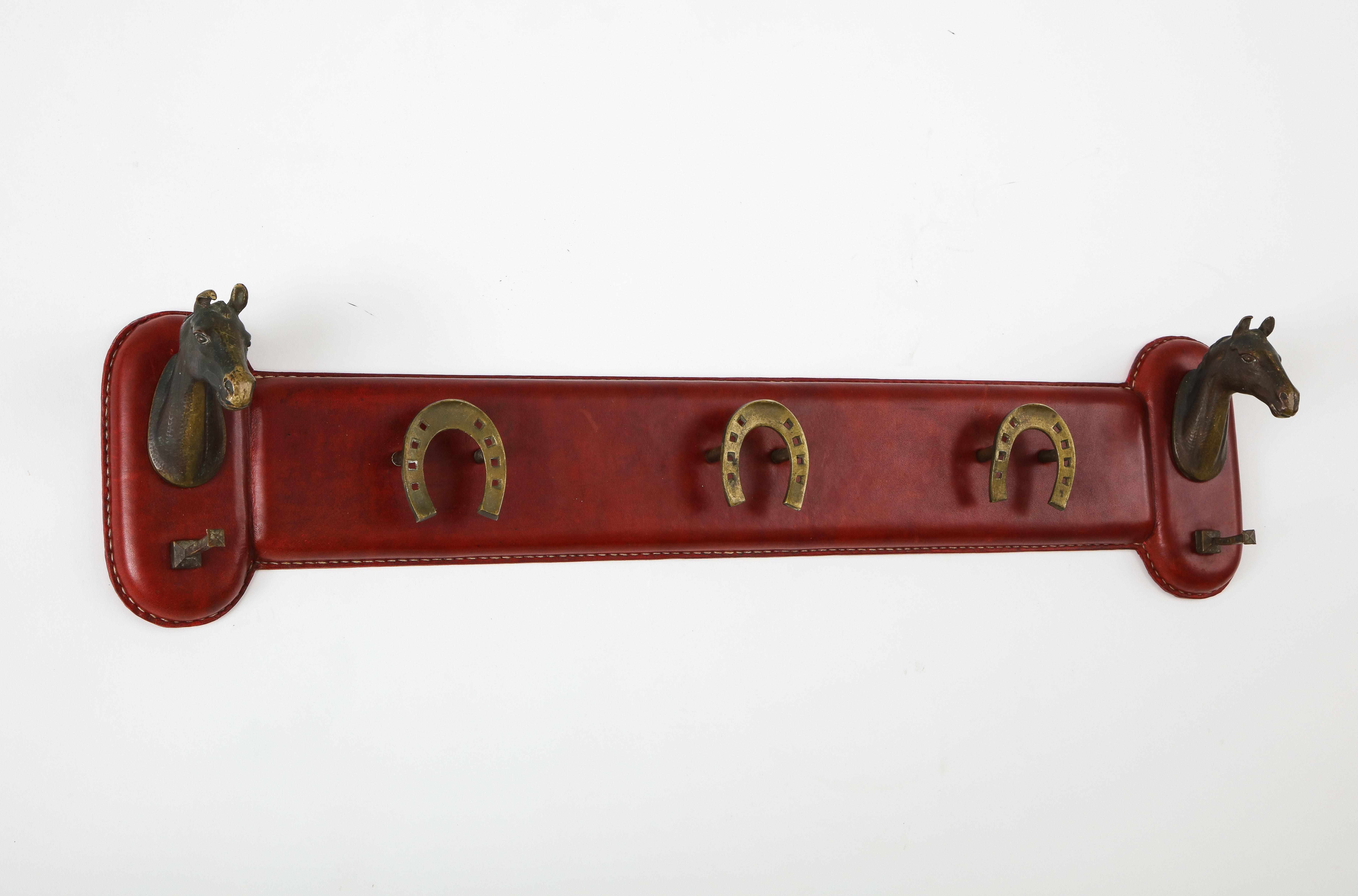 Very rare stitched leather coat rack by Jacques Adnet
Perfect shape.