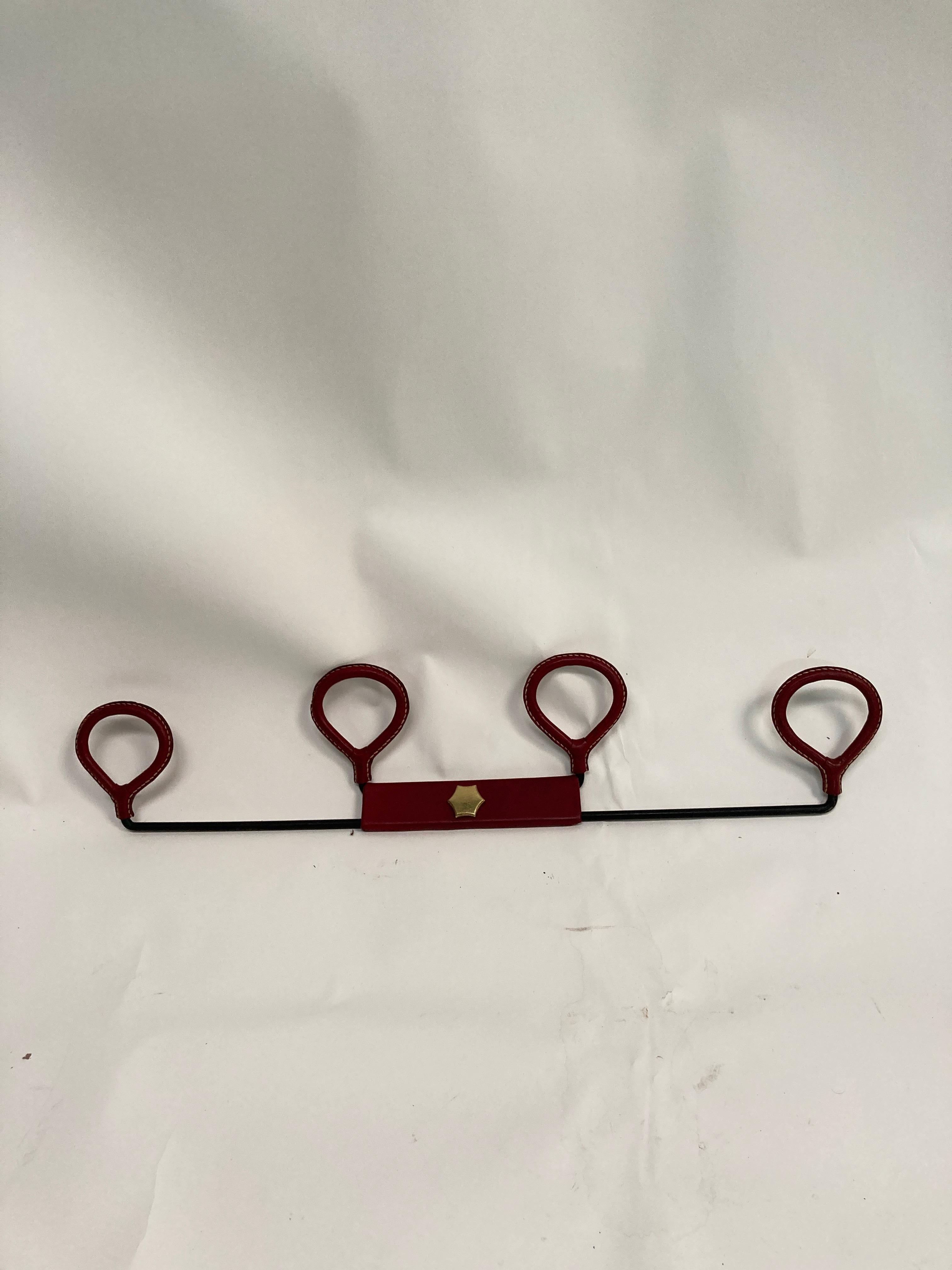1950's Stitched leather Coat rack by Jacques Adnet 
Red leather in great condition
