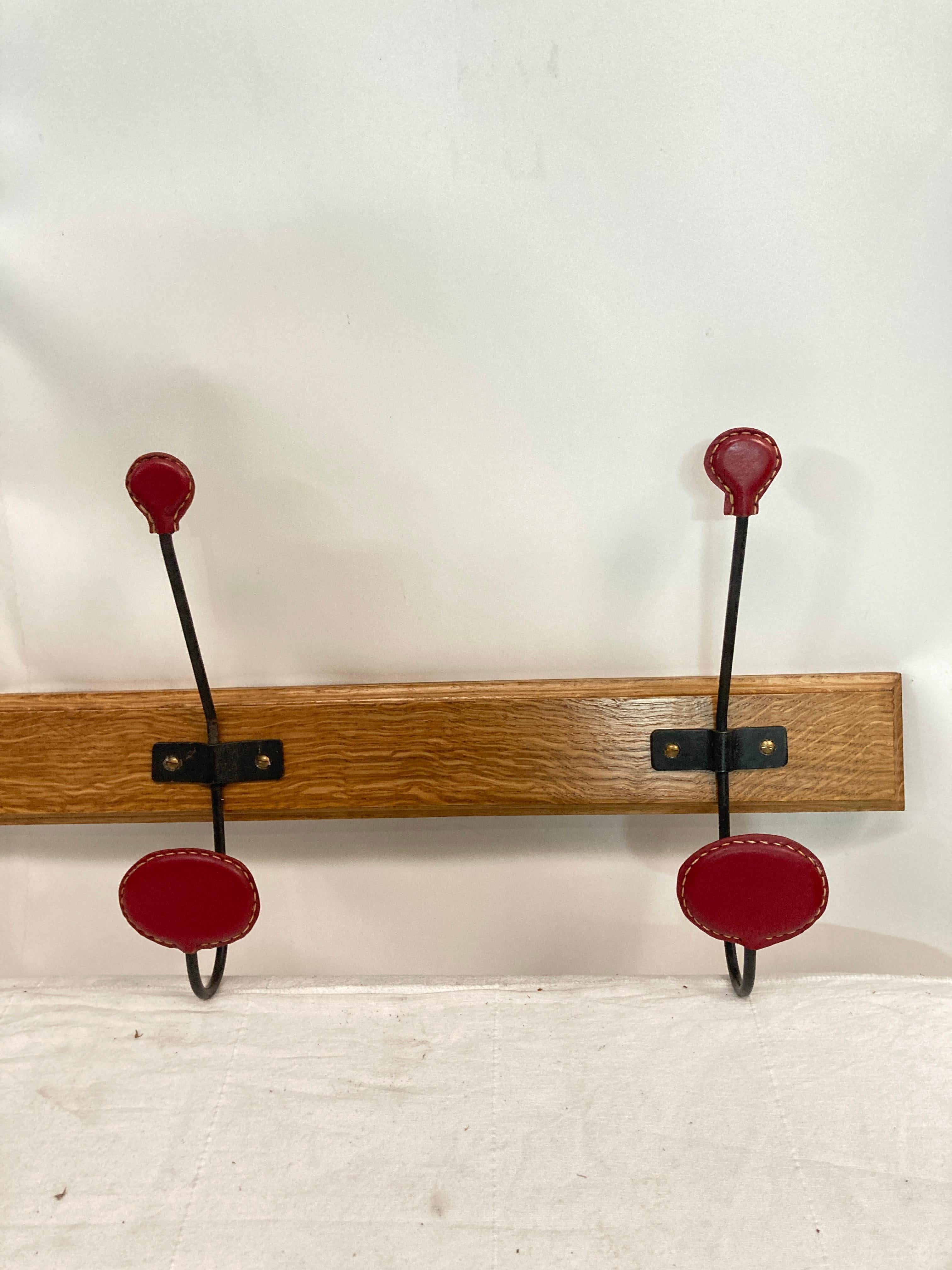 French 1950's Stitched leather coat rack by Jacques Adnet For Sale