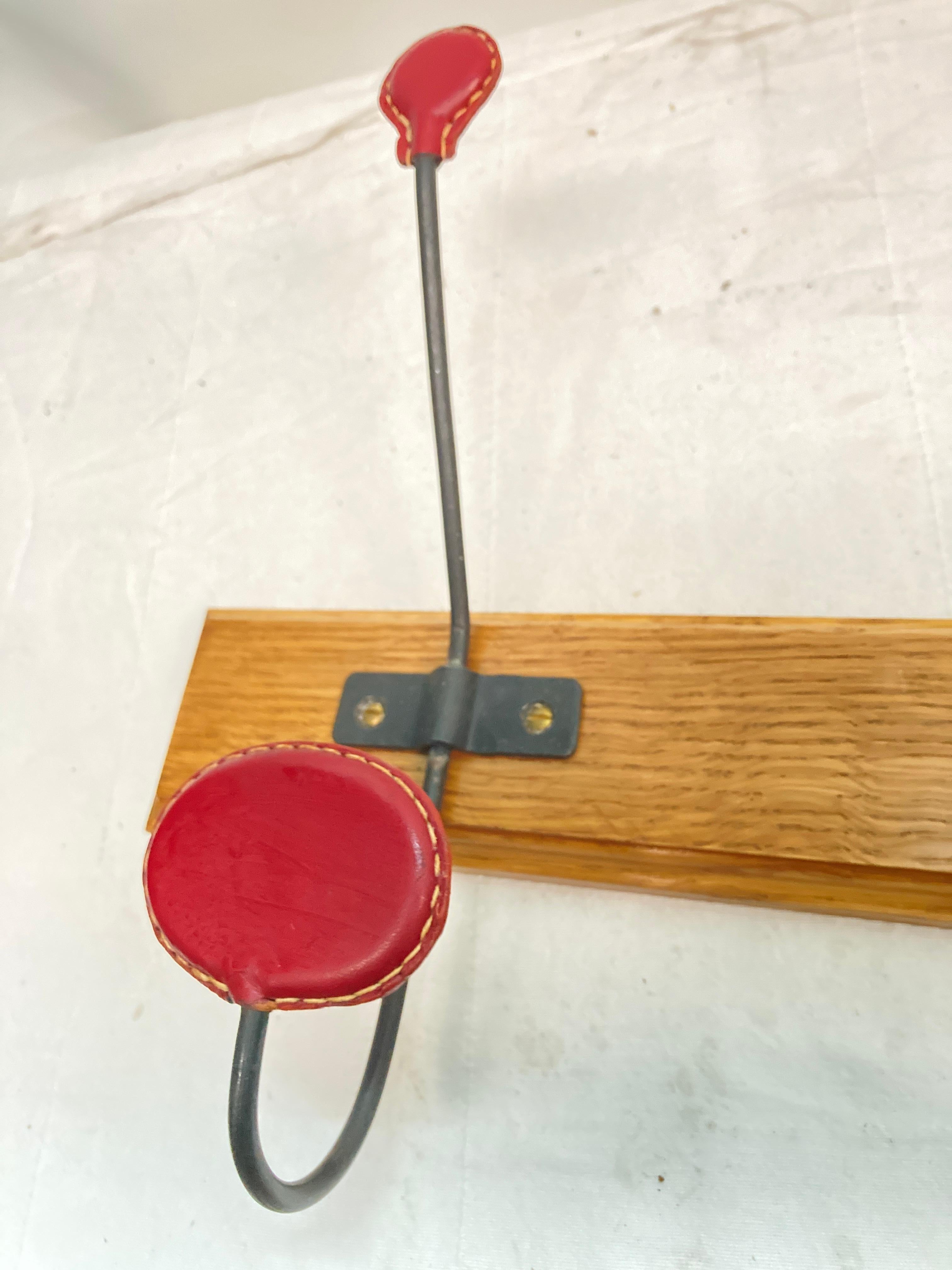 Leather 1950's Stitched leather coat rack by Jacques Adnet For Sale