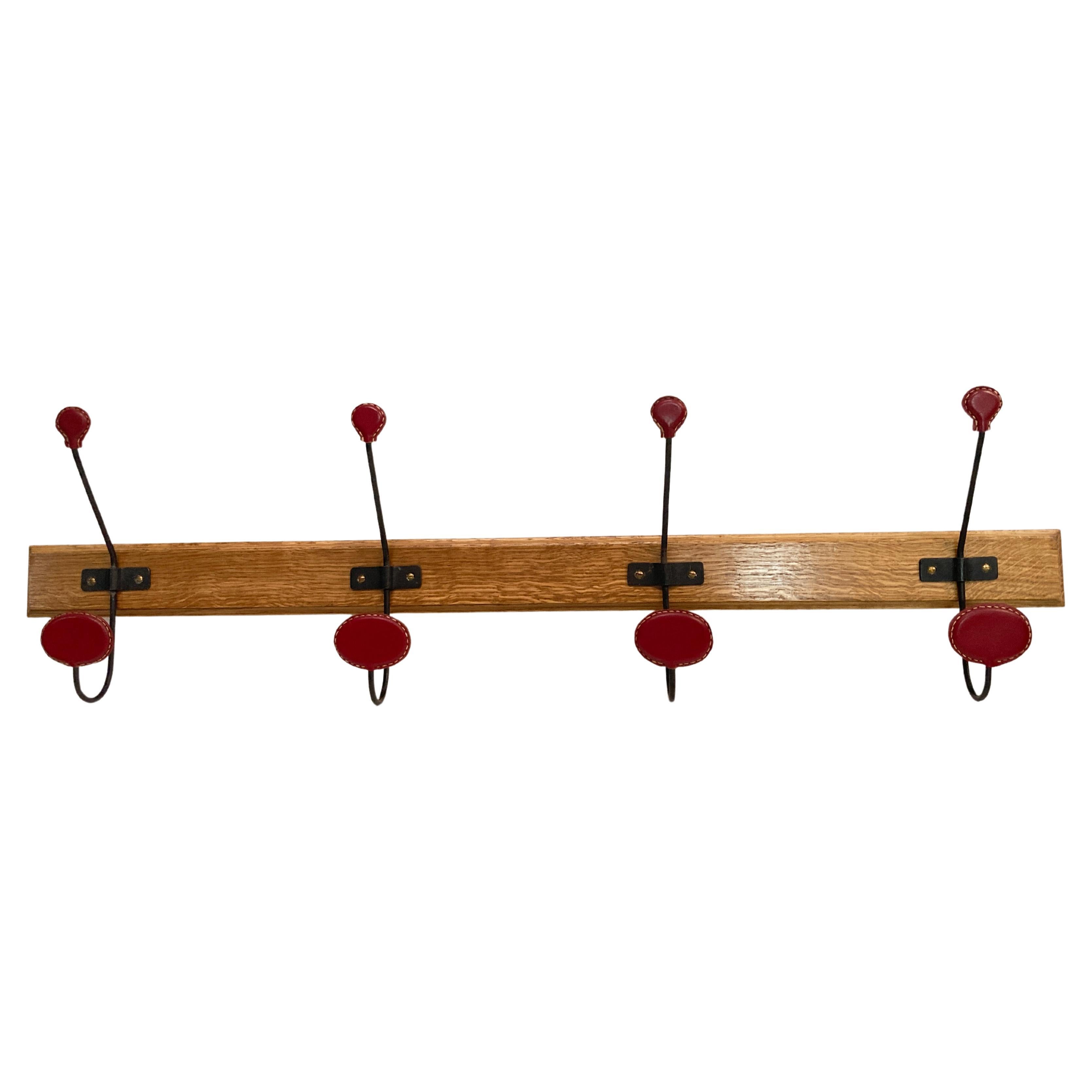 1950's Stitched leather coat rack by Jacques Adnet For Sale