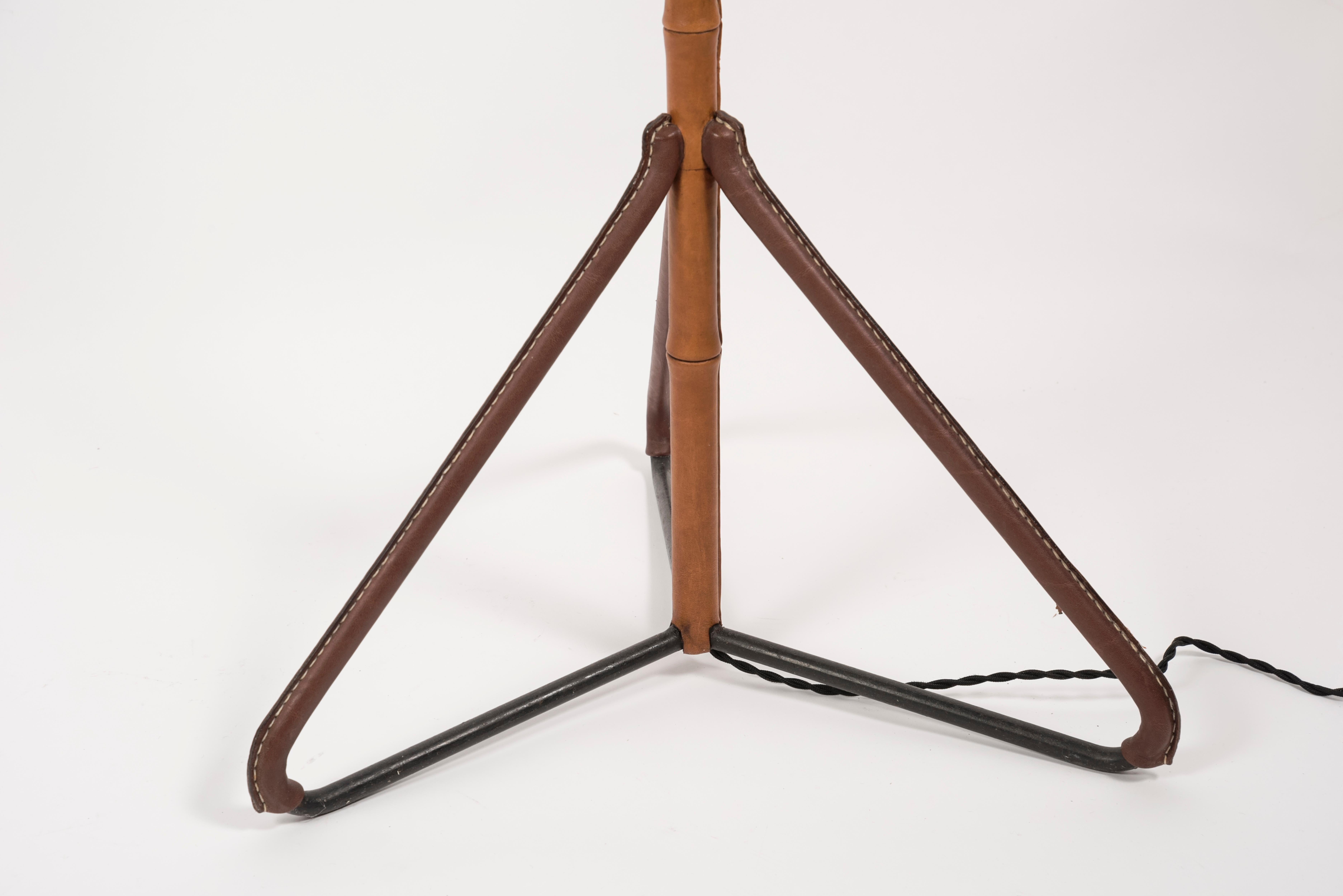Rare stitched leather floor lamp by Jacques Adnet
Circa 1950's
France.

 