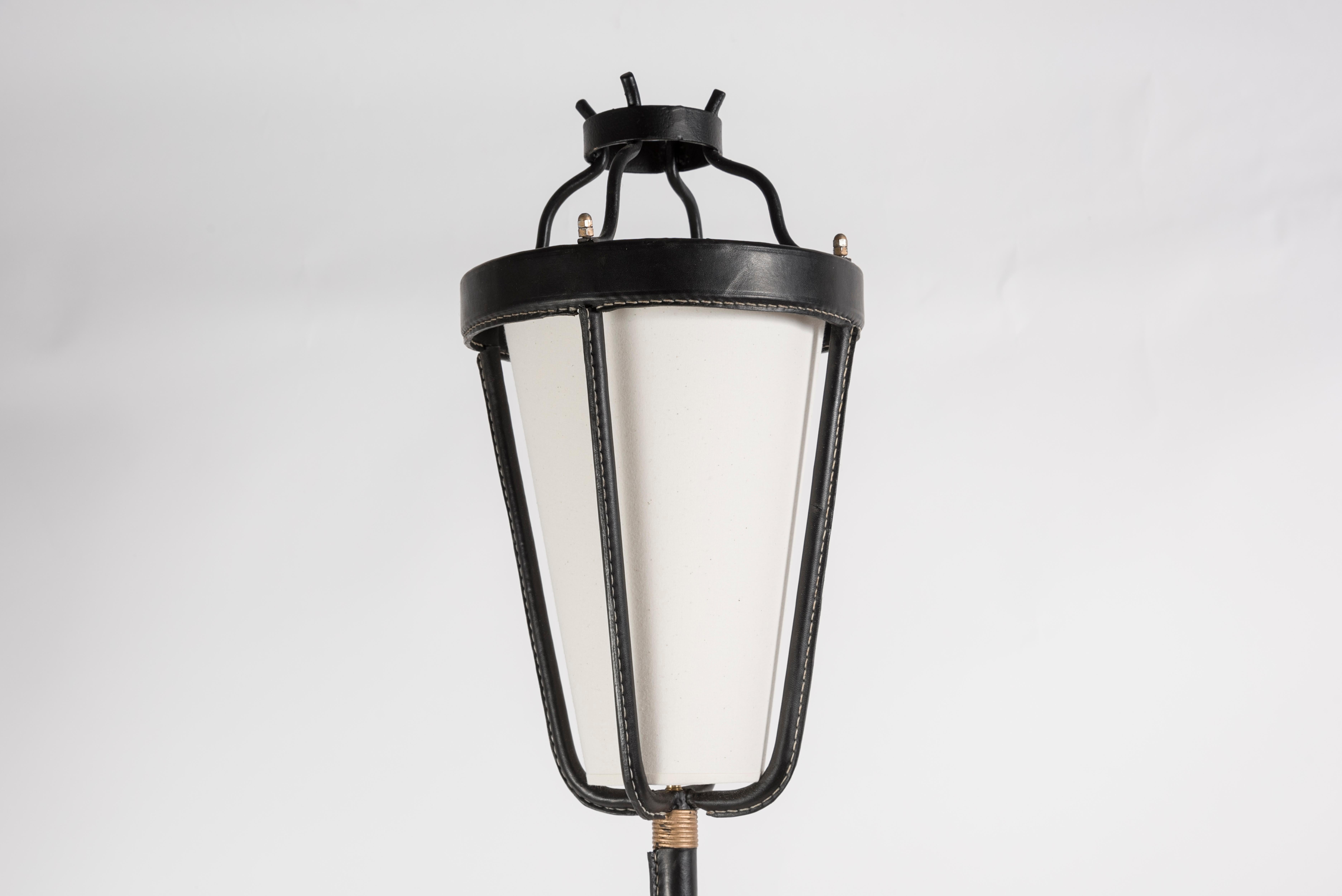 Rare black stitched leather lantern floor lamp By Jacques Adnet
France
1950's.