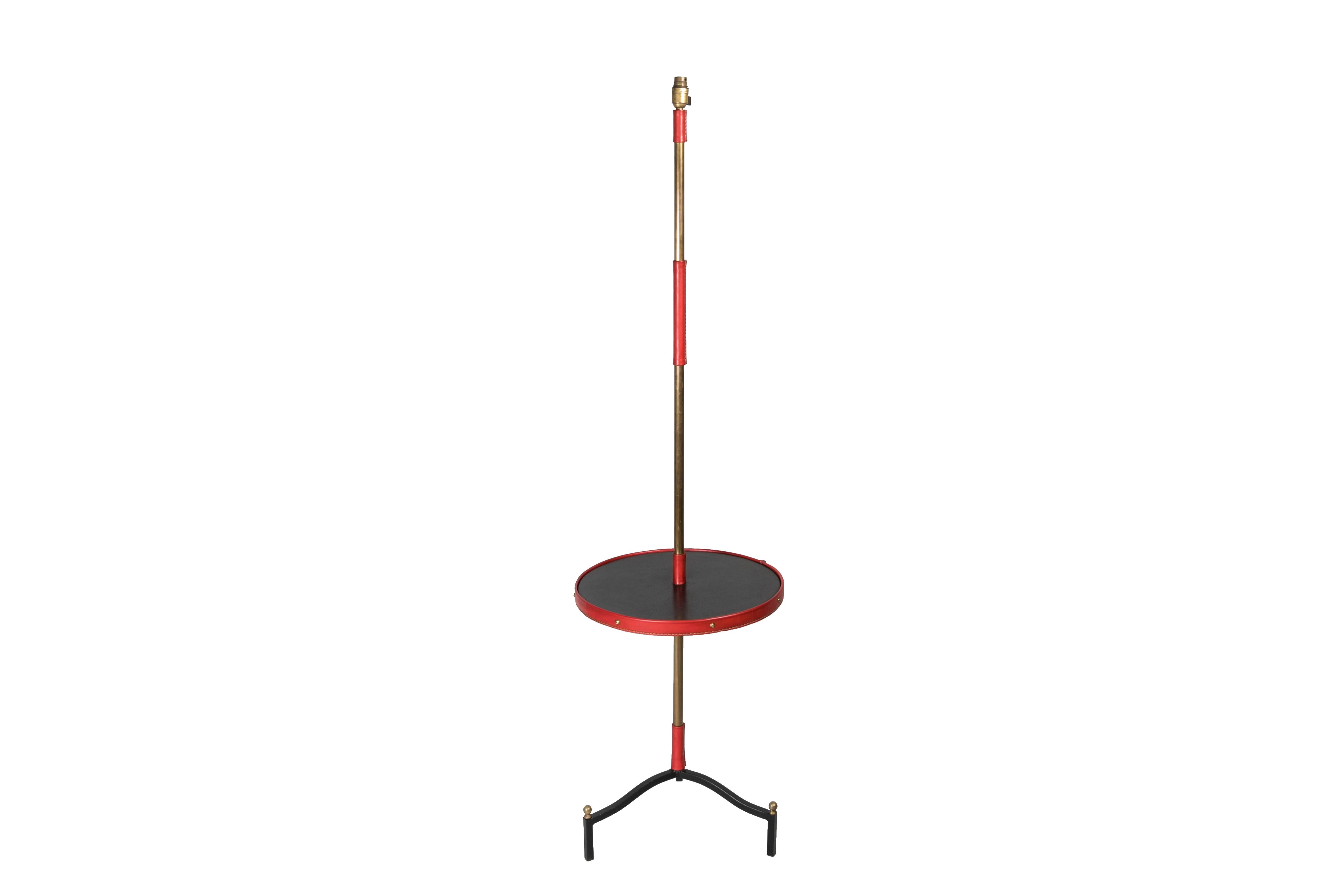 1950's Stitched leather floor lamp designed by Jacques Adnet
France
Bi-colour red and black
Dimensions given without shade, no shade provided.