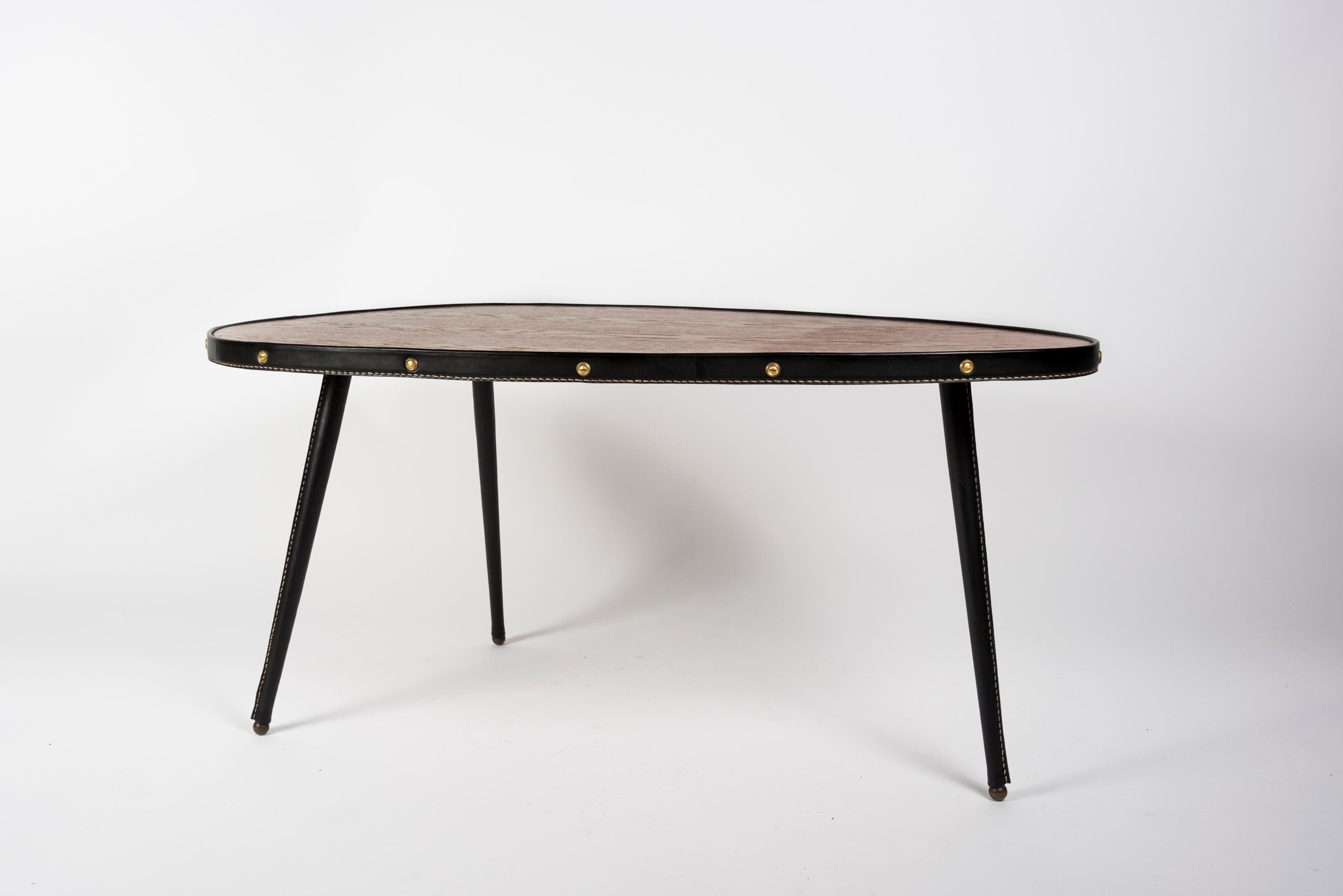 European 1950's Stitched leather free form cocktail table by Jacques Adnet For Sale