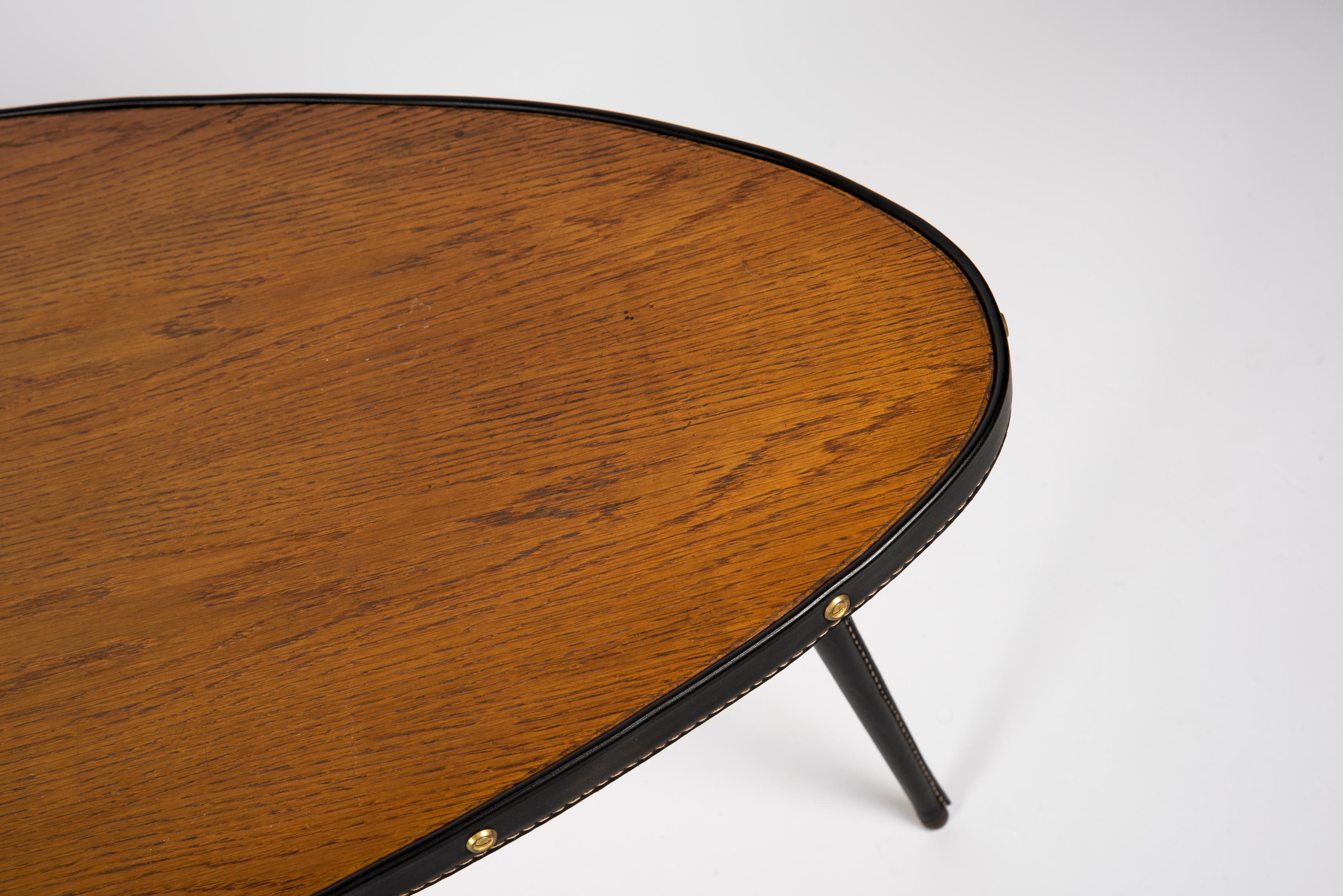 Leather 1950's Stitched leather free form cocktail table by Jacques Adnet For Sale