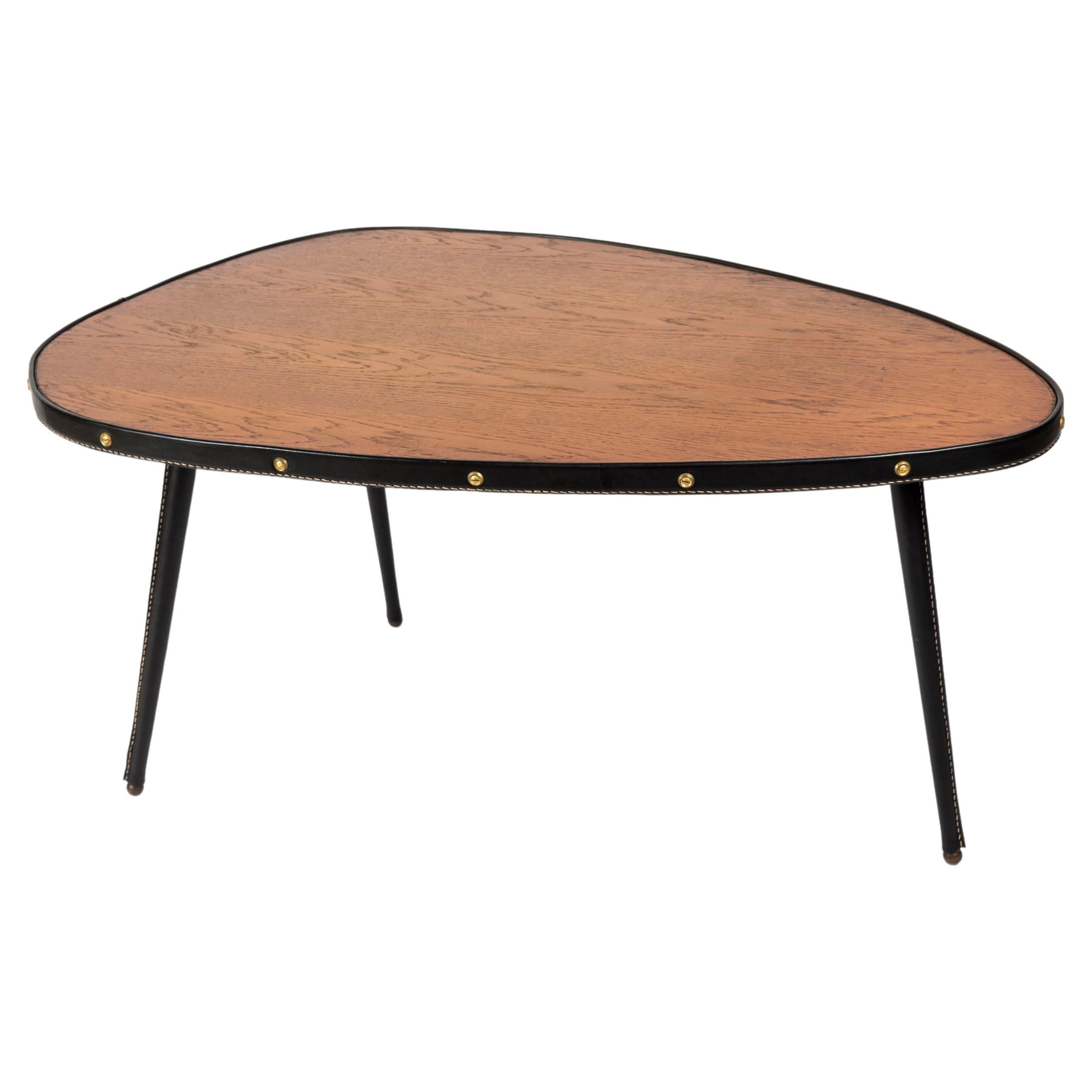 1950's Stitched leather free form cocktail table by Jacques Adnet For Sale