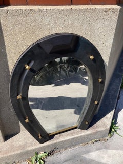 1950's Stitched Leather horse shoe mirror by Jacques Adnet
