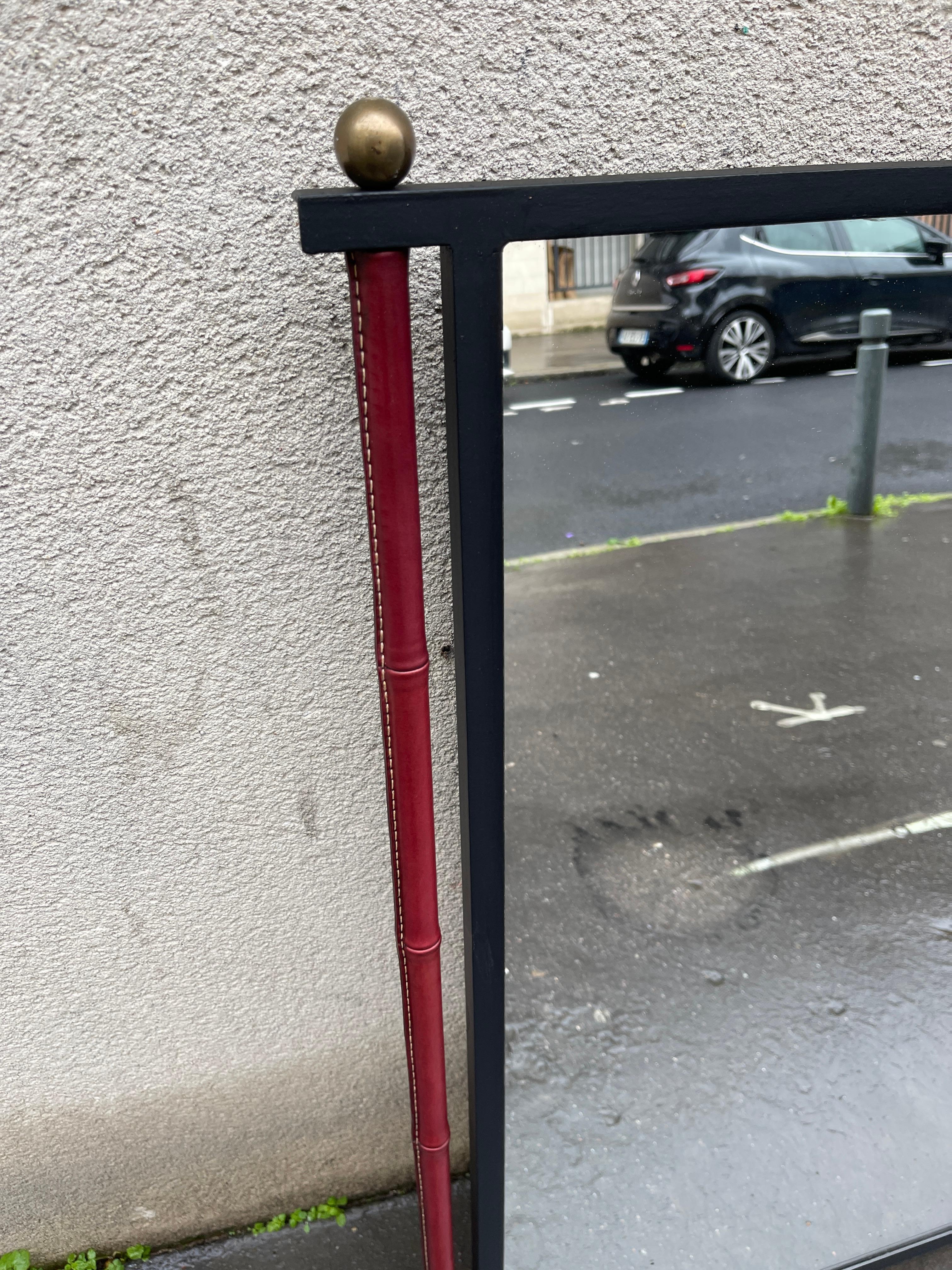 1950's Stitched leather wall mirror by Jacques Adnet
Burgundy 
