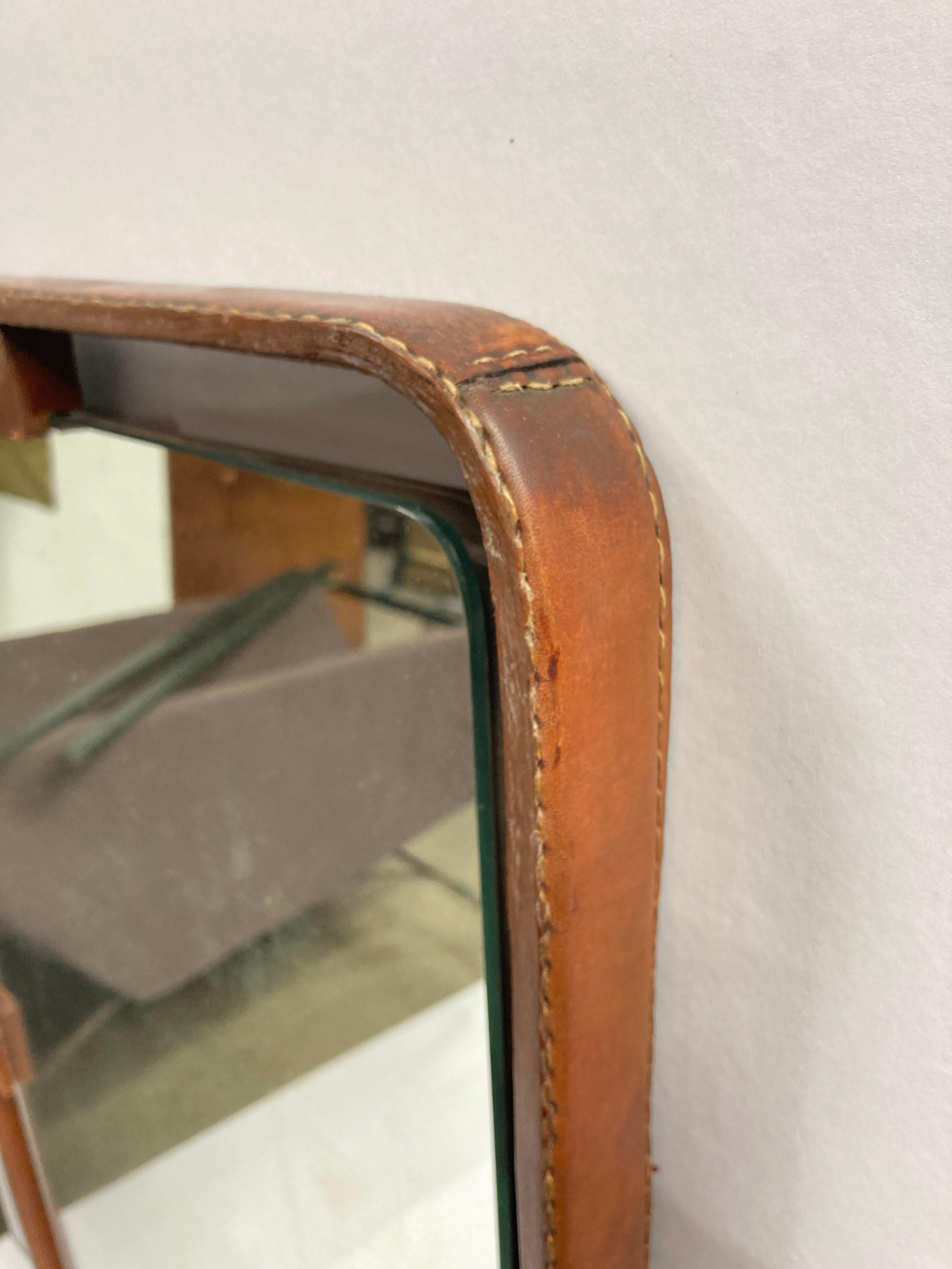 Leather 1950's Stitched leather mirror by Jacques Adnet For Sale