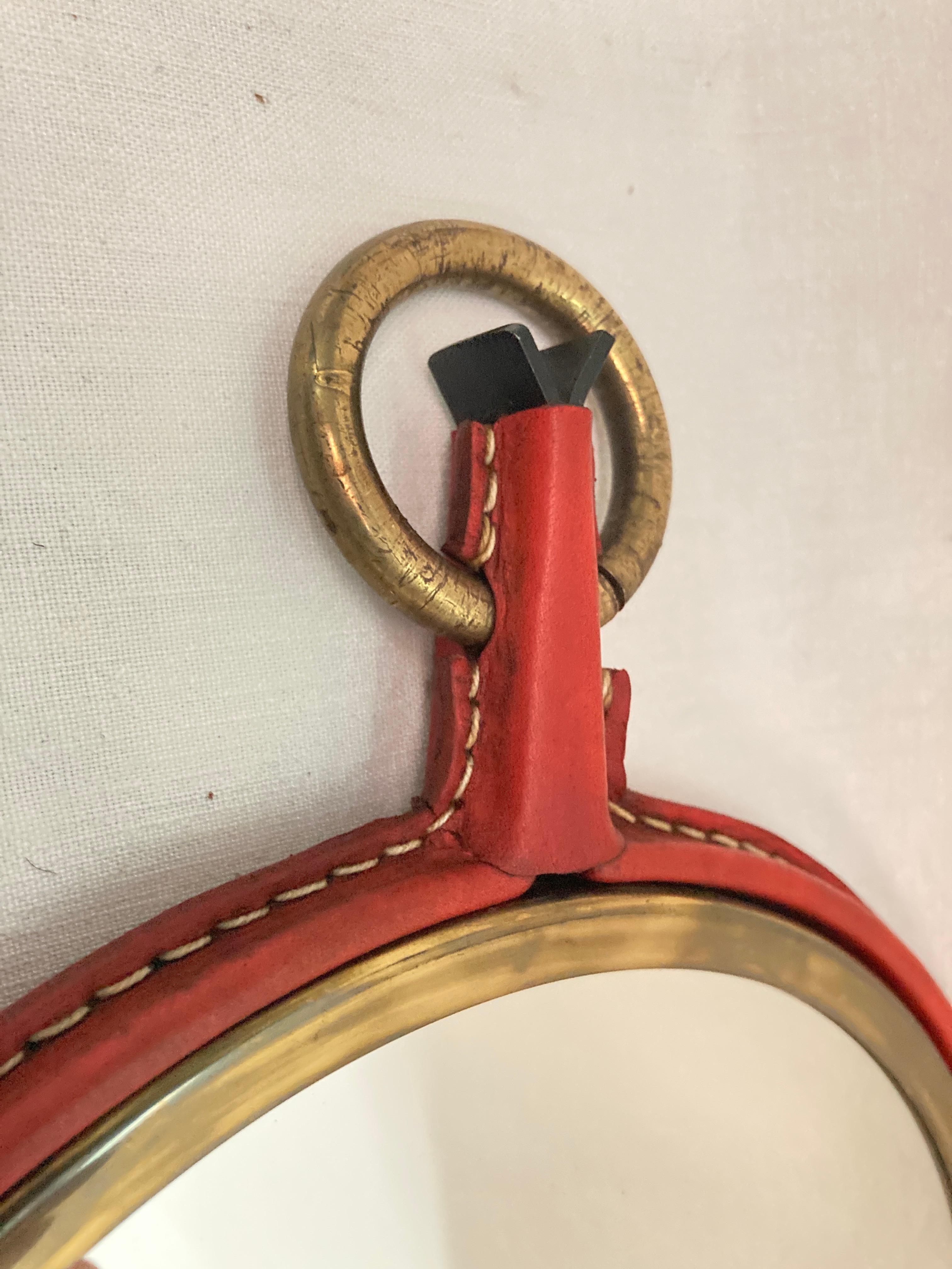 Metal 1950's Stitched leather mirror by Jacques Adnet