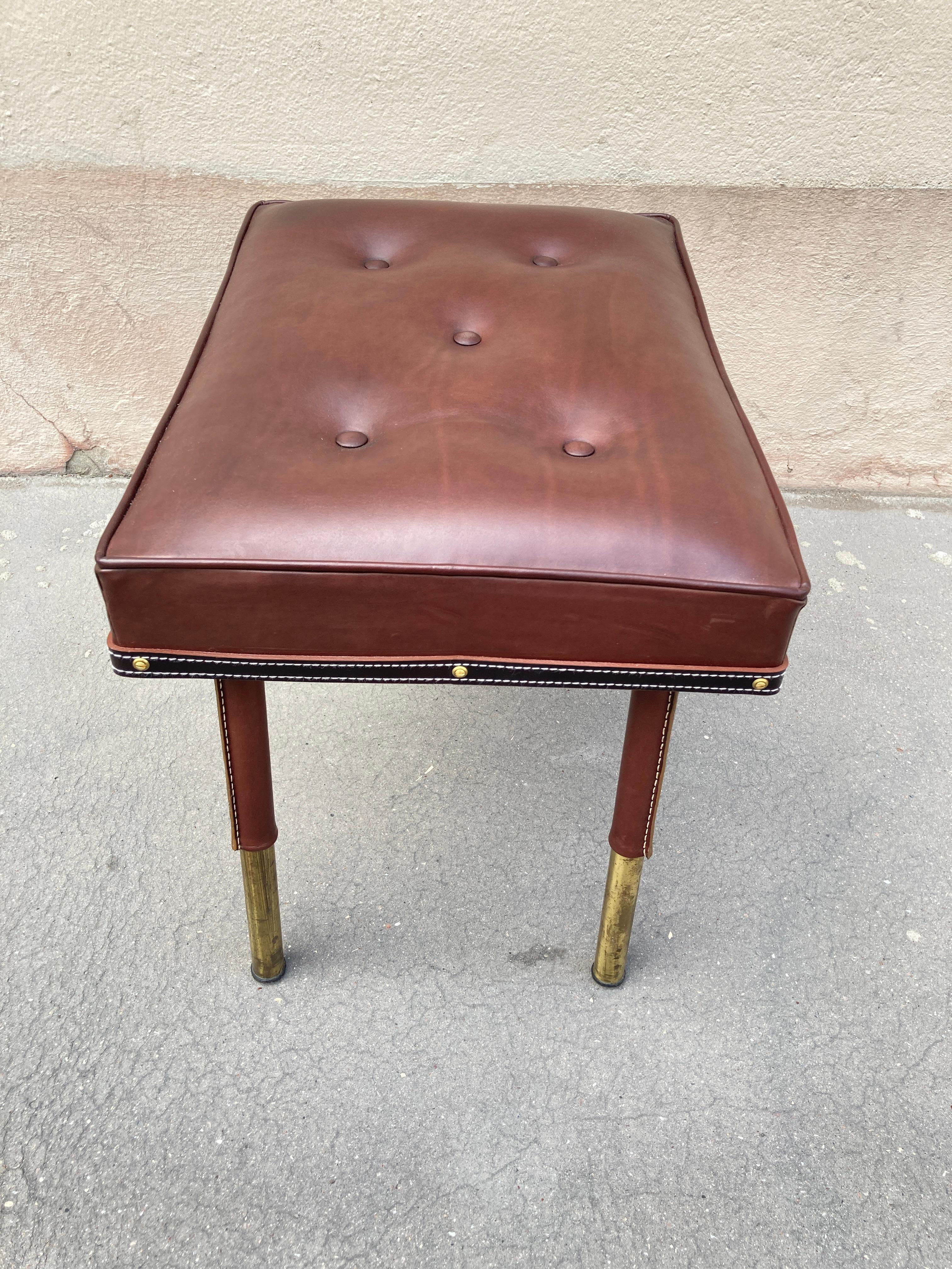 Mid-20th Century 1950's Stitched leather ottoman by Jacques Adnet For Sale