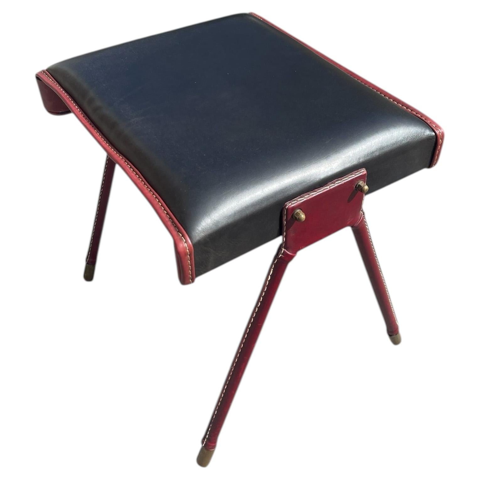 1950's Stitched leather ottoman by Jacques Adnet For Sale