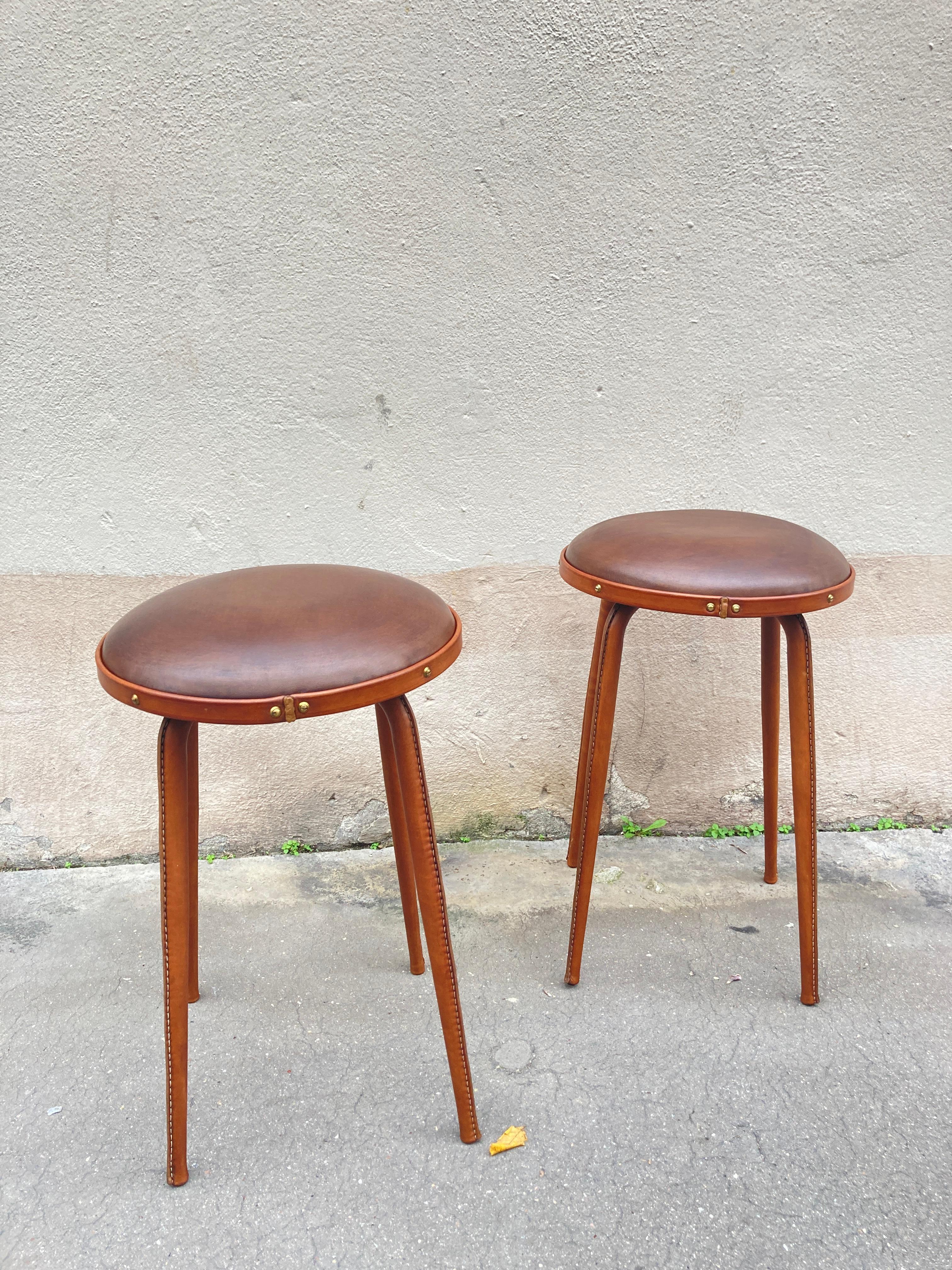 1950's Stitched leather stools by Jacques Adnet
France