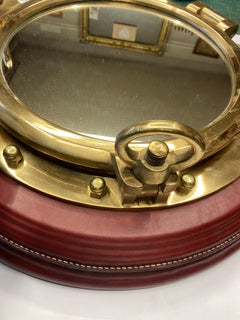 1950's Stitched leather " porthole "mirror by Jacques Adnet