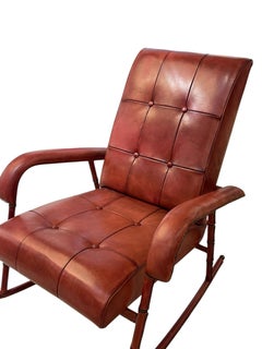 1950's Stitched leather Rocking chair and ottoman by Jacques Adnet