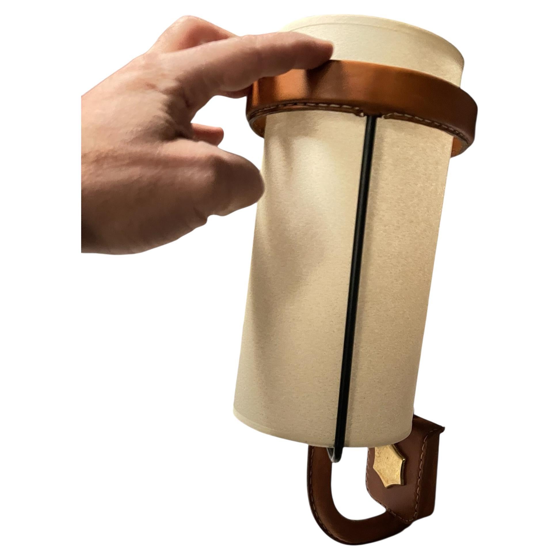 1950's Pair of Stitched leather sconces by Jacques Adnet
Great condition
France
A Rare French Midcentury Modern hand stitched leather sconces by Jacques Adnet, circa 1955. Adnet had a rare talent for creating works that had used exquisite form and