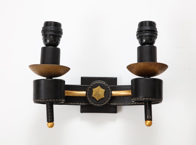 European 1950's Stitched leather sconces by Jacques Adnet For Sale
